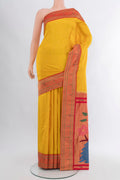 Mustard Paithani Silk Saree with Zari Butta on the body and Paithani Border.  displayed on a mannequin