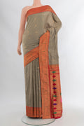 Beige Soft Silk Saree with Zari Butta on the body and Silk Border.  displayed on a mannequin