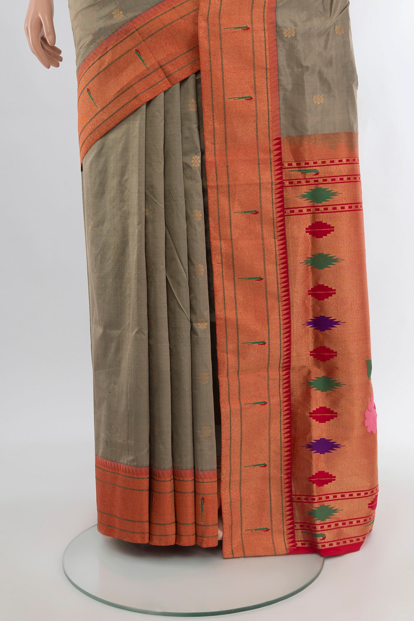 Pleats and pallu of Beige Soft Silk Saree with Zari Butta on the body and Silk Border. 