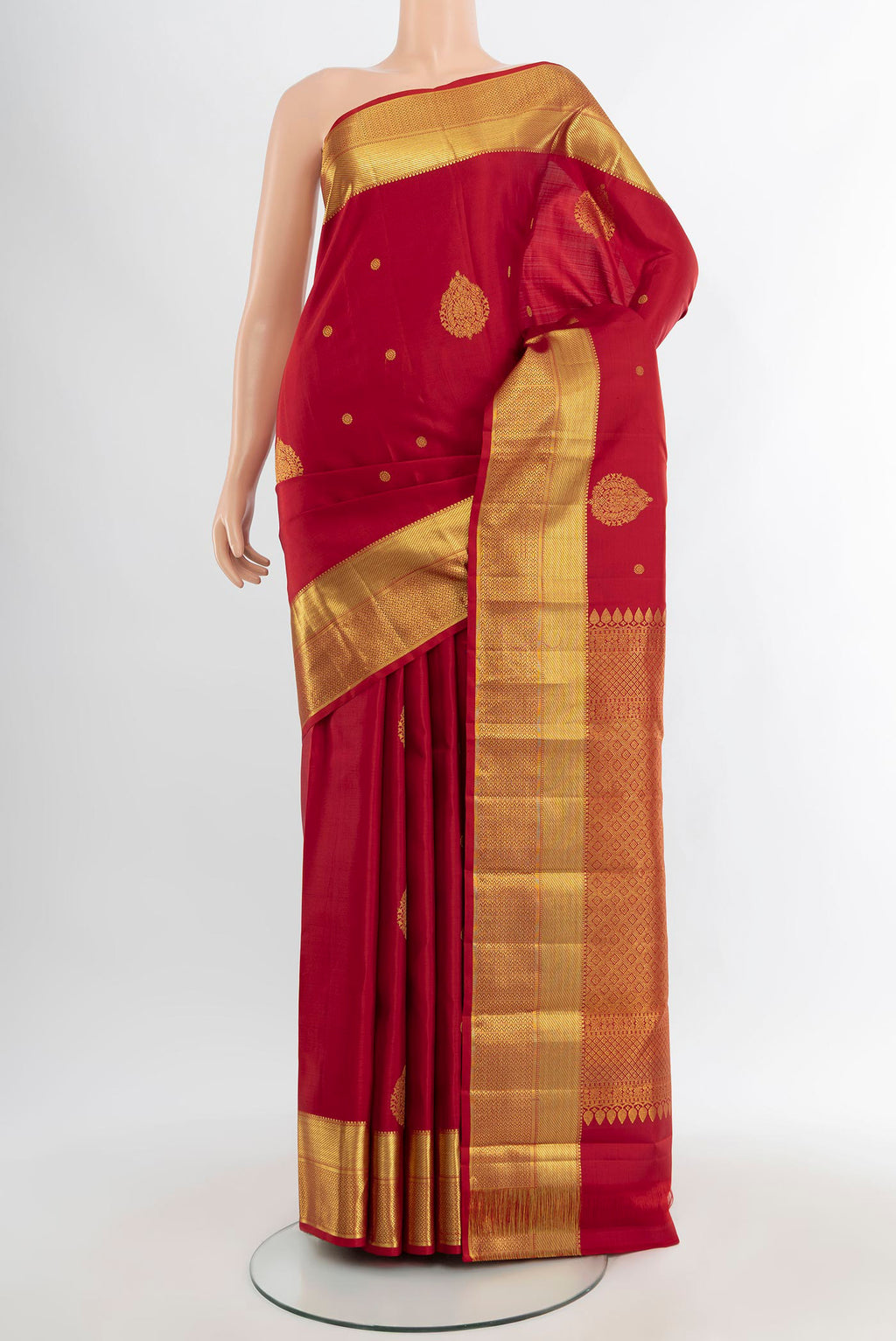 Maroon Kanjivaram Silk Saree with Zari Butta on the body and Zari Border.  displayed on a mannequin