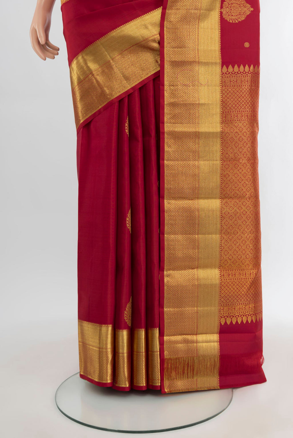 Pleats and pallu of Maroon Kanjivaram Silk Saree with Zari Butta on the body and Zari Border. 