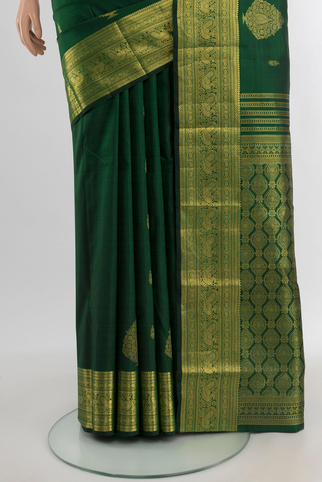 Pleats and pallu of Bottle Green Kanjivaram Silk Saree with Zari Butta on the body and Zari Border. 