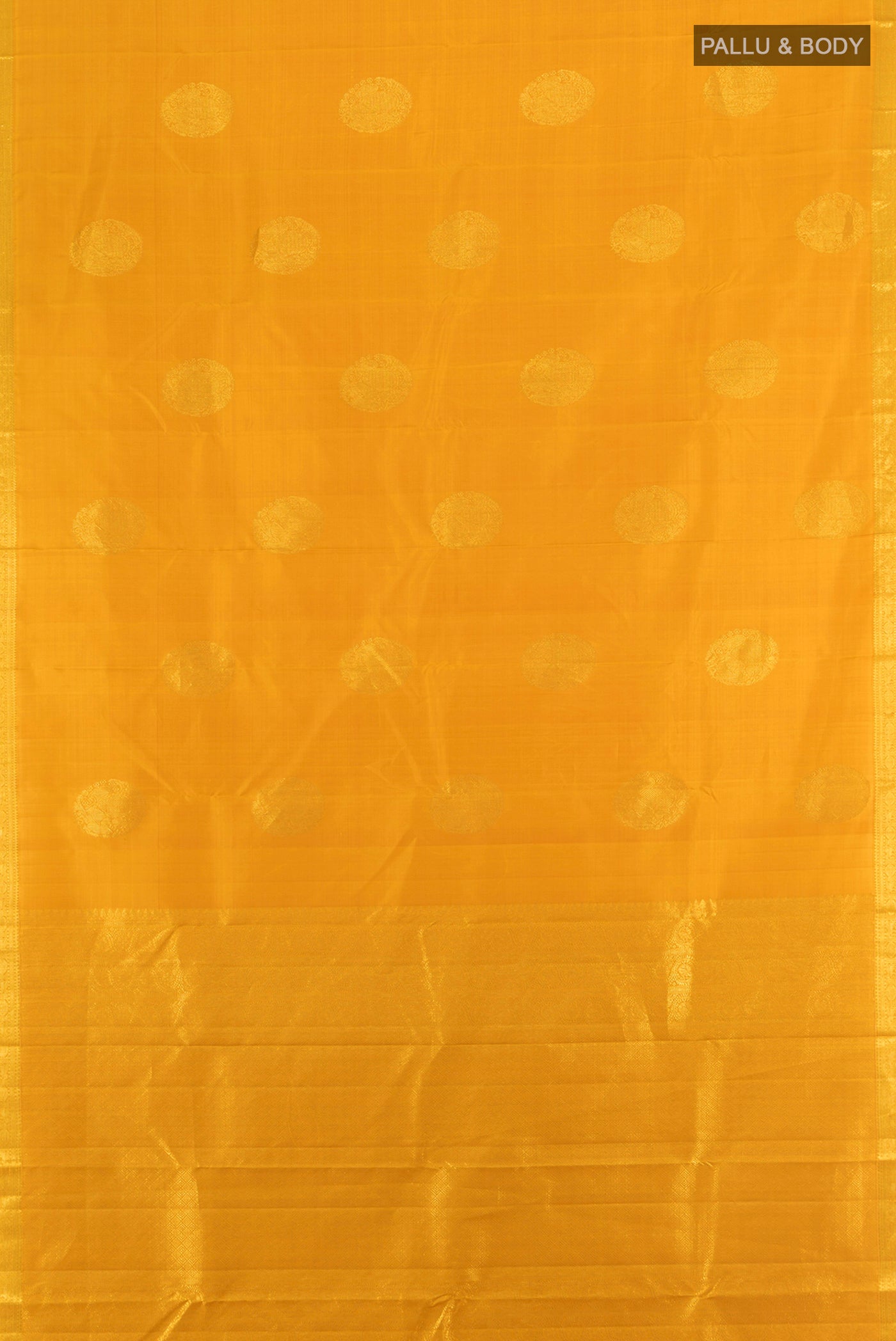 Flat view of Mustard Kanchipuram Silk Saree with Zari Butta on the body and Zari Border. 