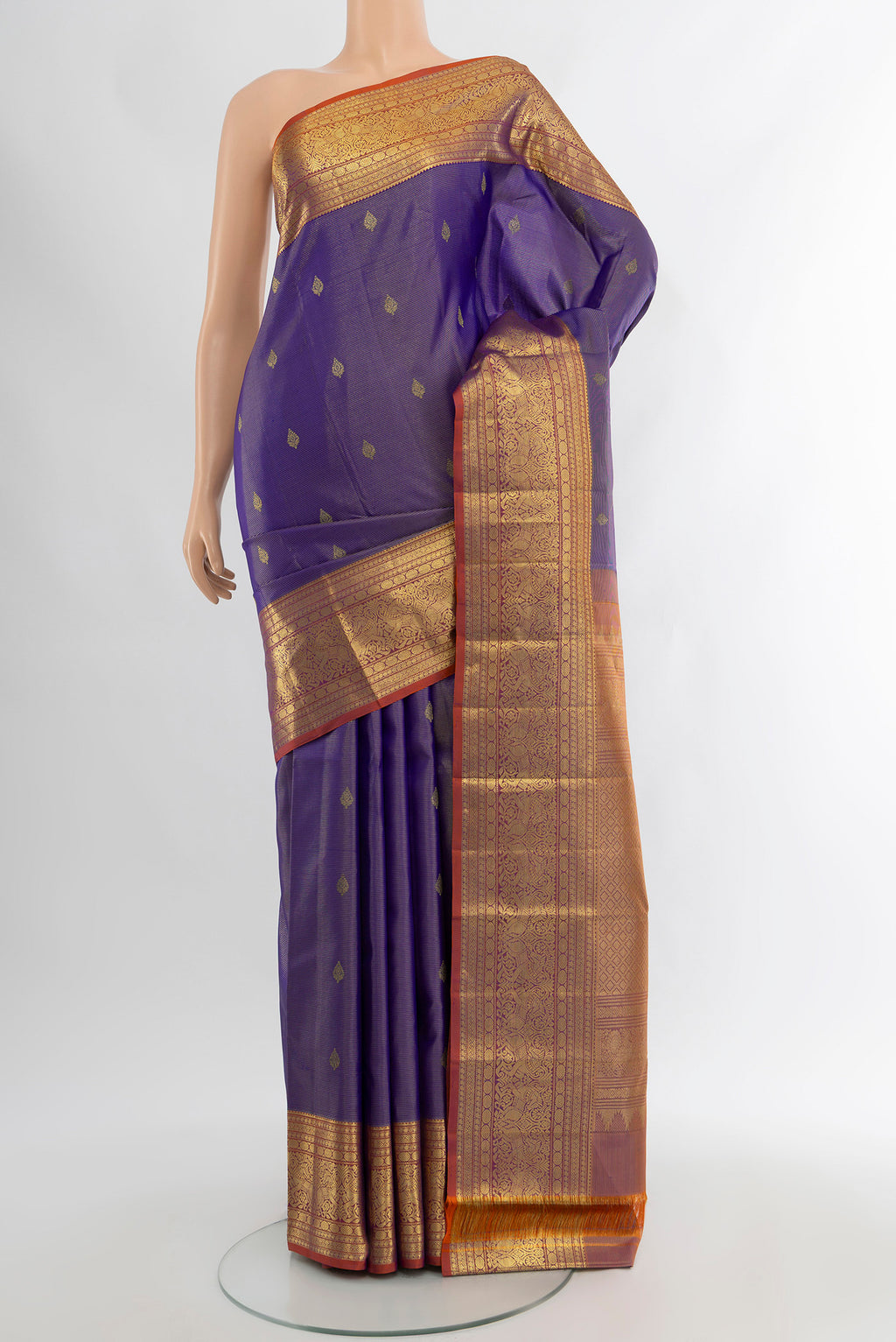 Violet Kanjivaram Silk Saree with Zari Butta on the body and Zari Border.  displayed on a mannequin