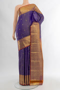 Violet Kanjivaram Silk Saree with Zari Butta on the body and Zari Border.  displayed on a mannequin