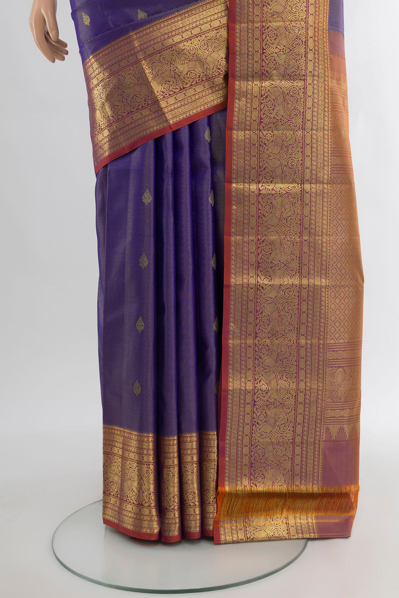 Pleats and pallu of Violet Kanjivaram Silk Saree with Zari Butta on the body and Zari Border. 