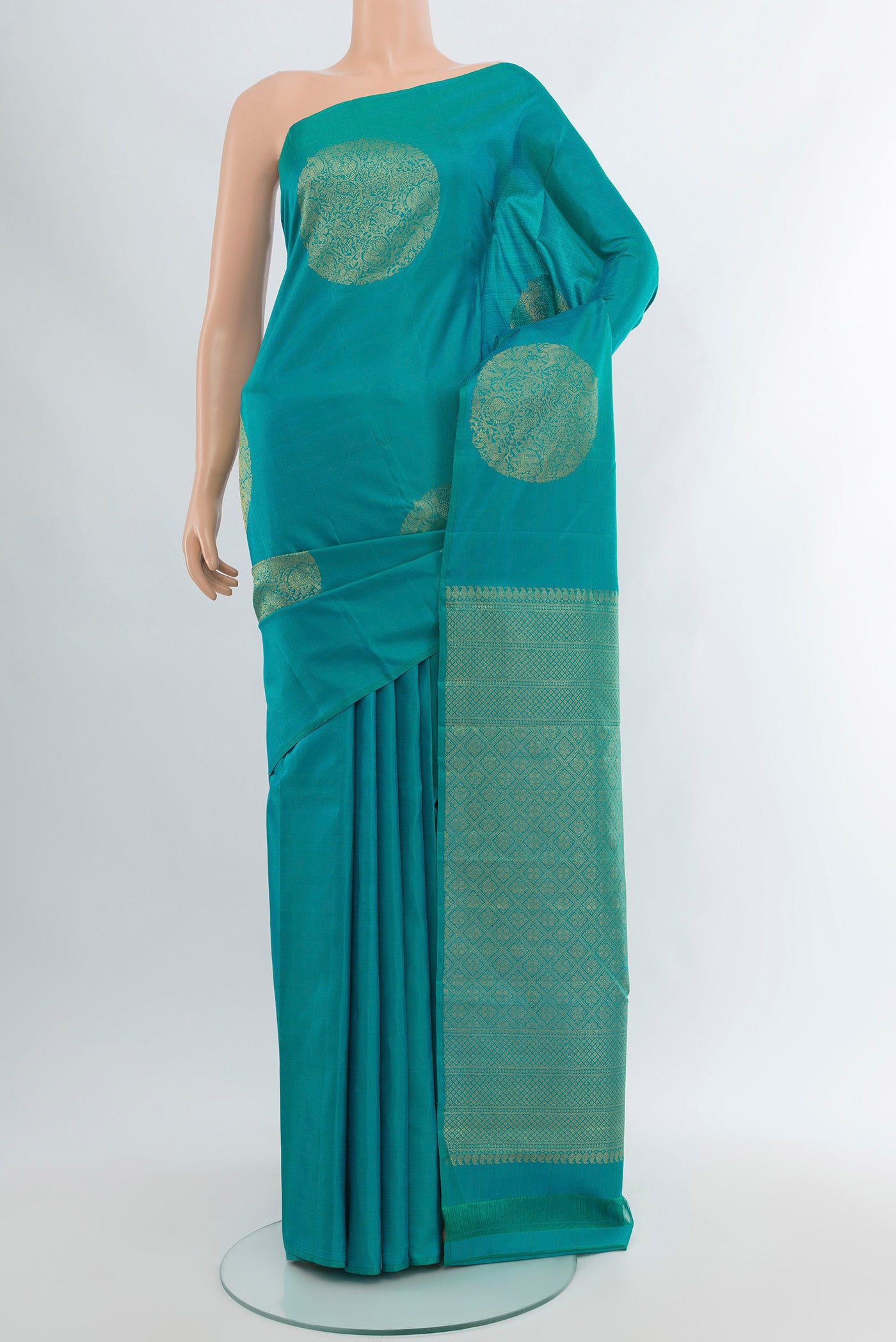 Light Blue Kanchipuram Silk Saree with Zari Butta on the body and Without Border.  displayed on a mannequin