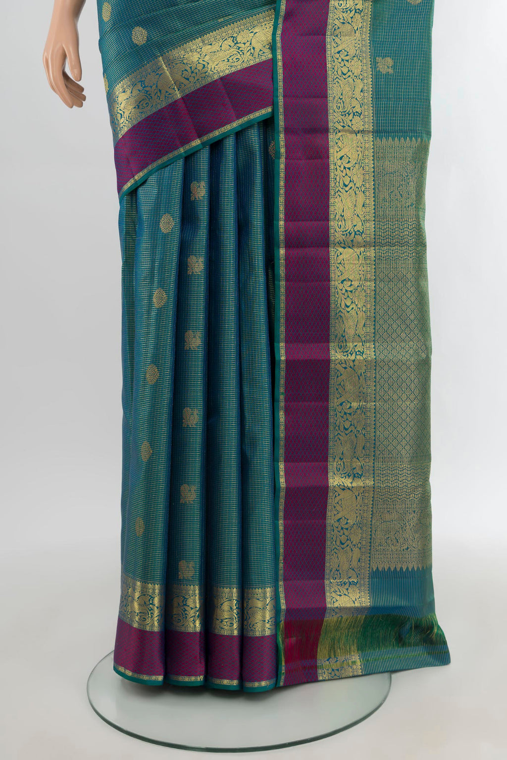 Pleats and pallu of Peacock Blue Kanjivaram Silk Saree with Zari Butta on the body and Zari Border. 