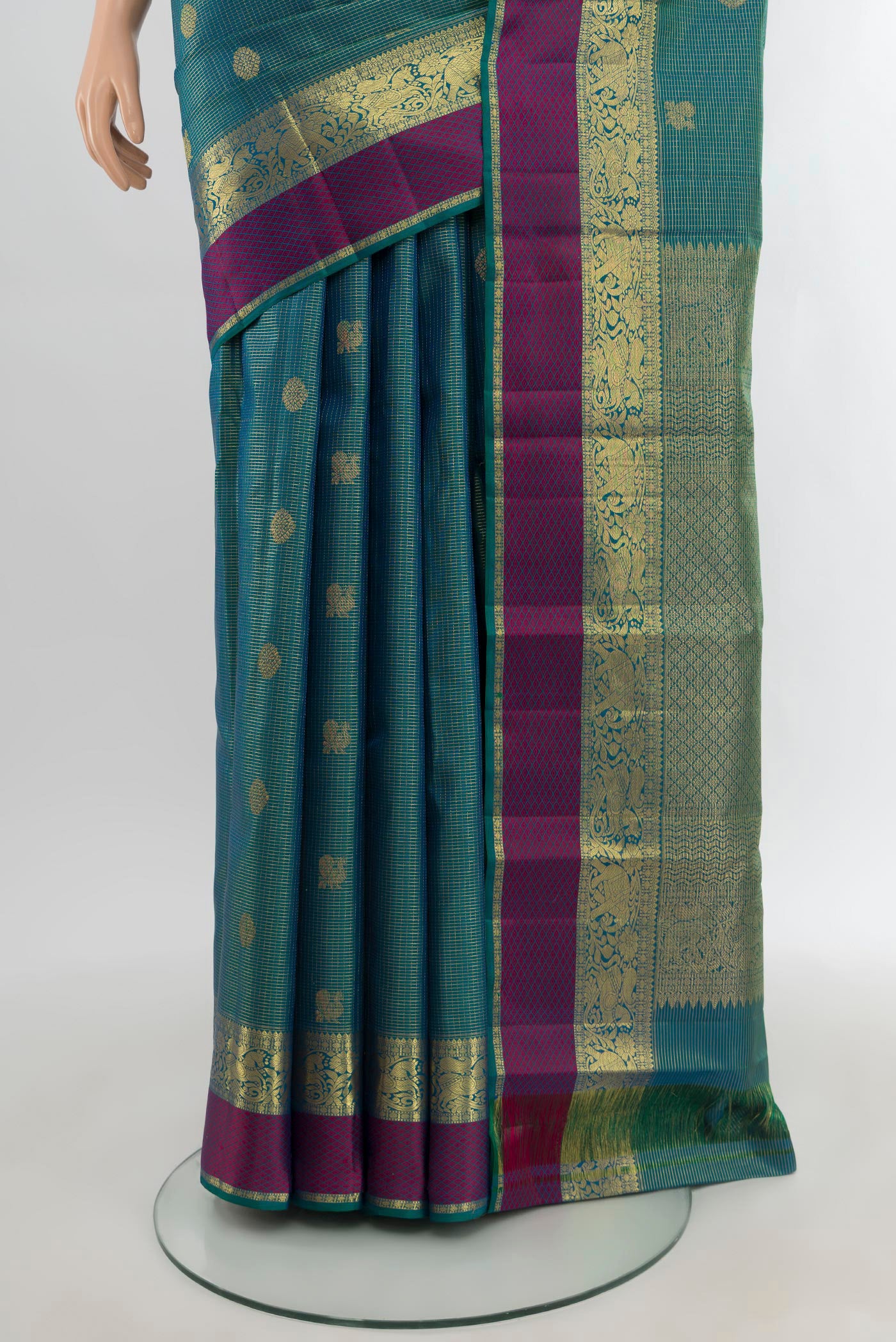 Pleats and pallu of Peacock Blue Kanjivaram Silk Saree with Zari Butta on the body and Zari Border. 