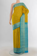 Pure Silk Yellow Kanjivaram Saree with Zari Butta on the body and Silk Border.  displayed on a mannequin