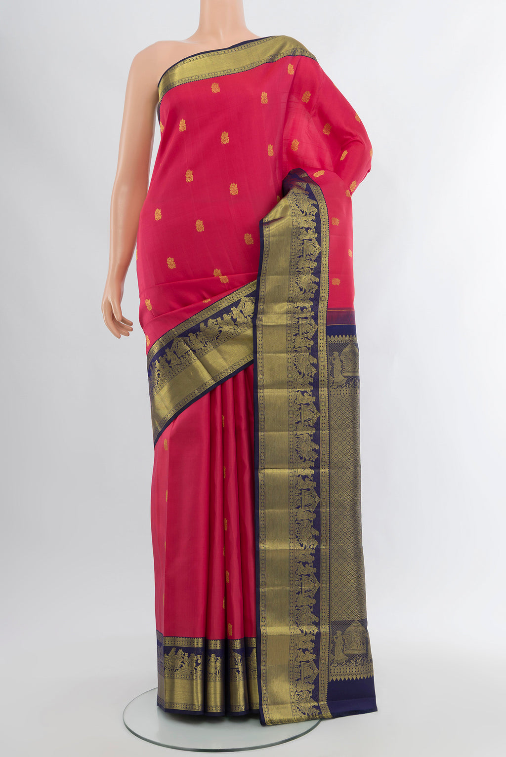 Pink Kanjivaram Silk Saree with Zari Butta on the body and Zari Border.  displayed on a mannequin