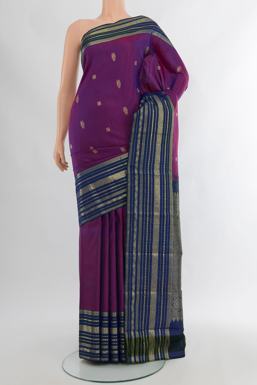Purple Kanjivaram Silk Saree with Zari Butta on the body and Zari Border.  displayed on a mannequin