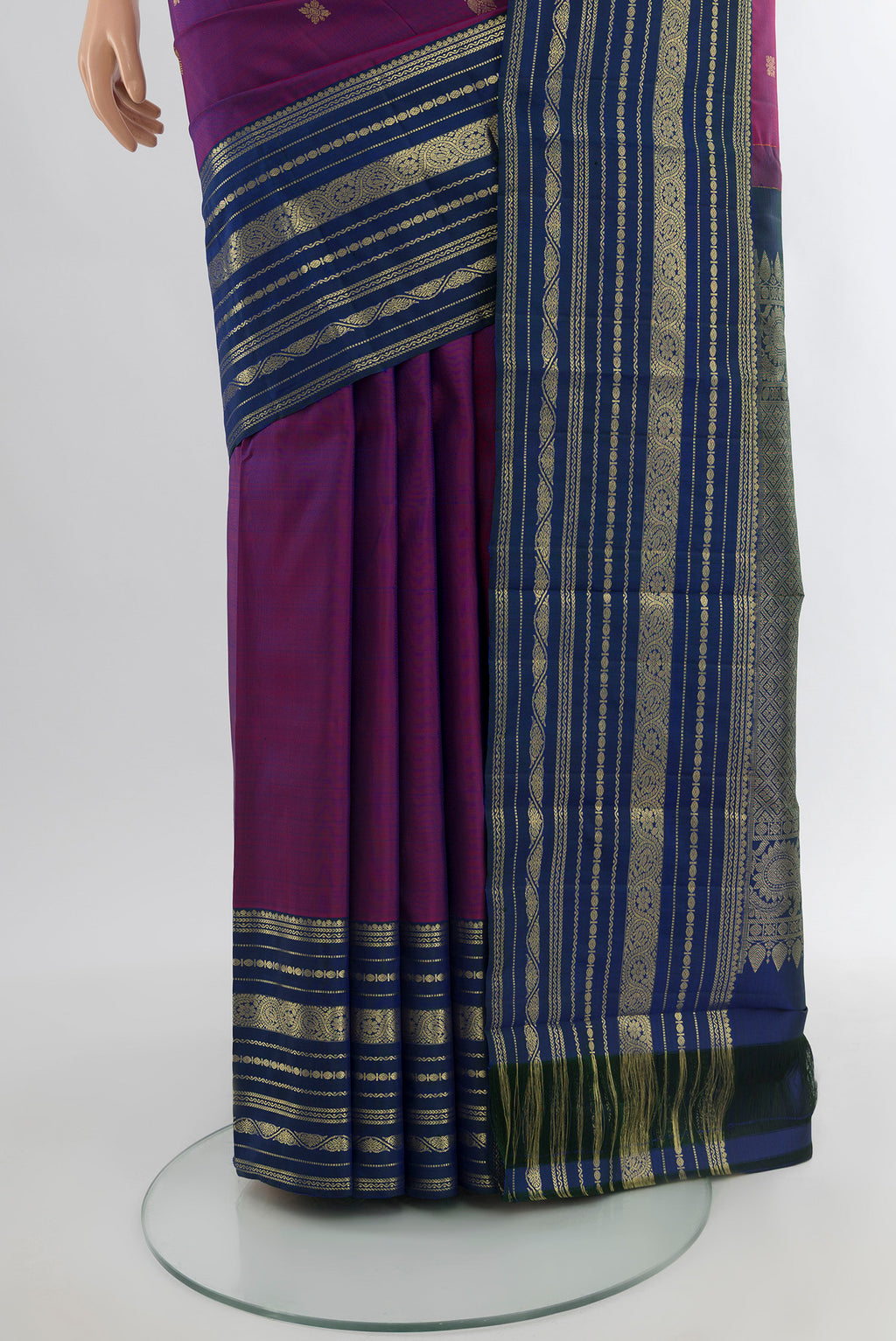 Pleats and pallu of Purple Kanjivaram Silk Saree with Zari Butta on the body and Zari Border. 