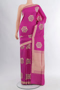 Magenta Banarasi Silk Saree with Zari Butta on the body and Zari Border.  displayed on a mannequin