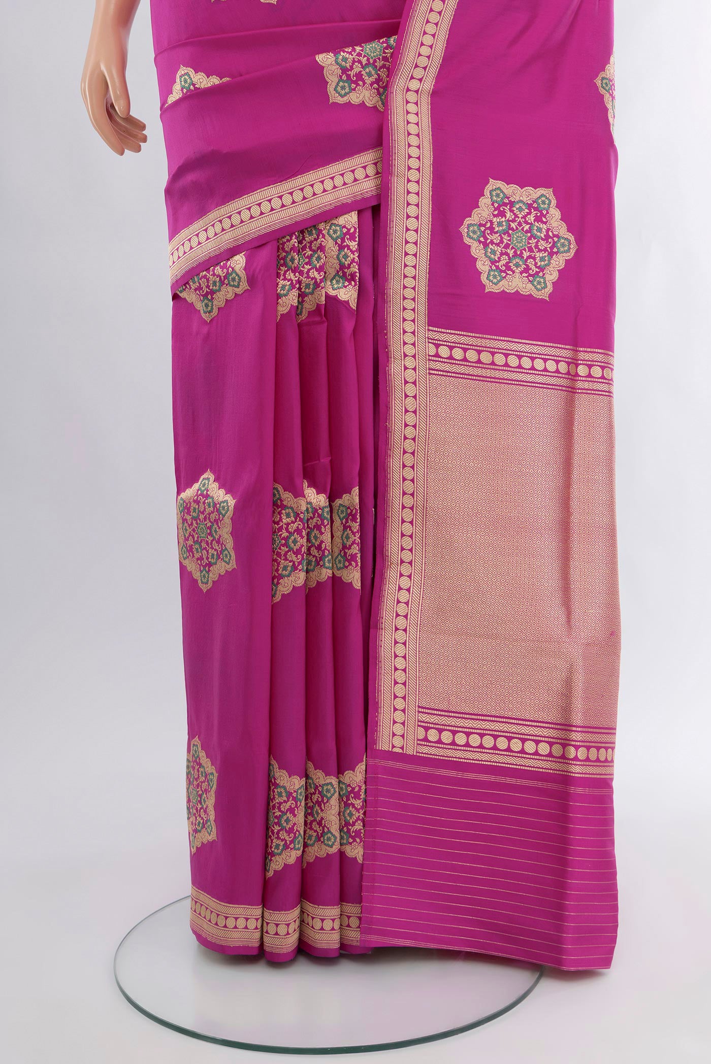 Pleats and pallu of Magenta Banarasi Silk Saree with Zari Butta on the body and Zari Border. 