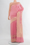 Rose pink Banarasi Silk Saree with Plain Body and Fancy Border.  displayed on a mannequin