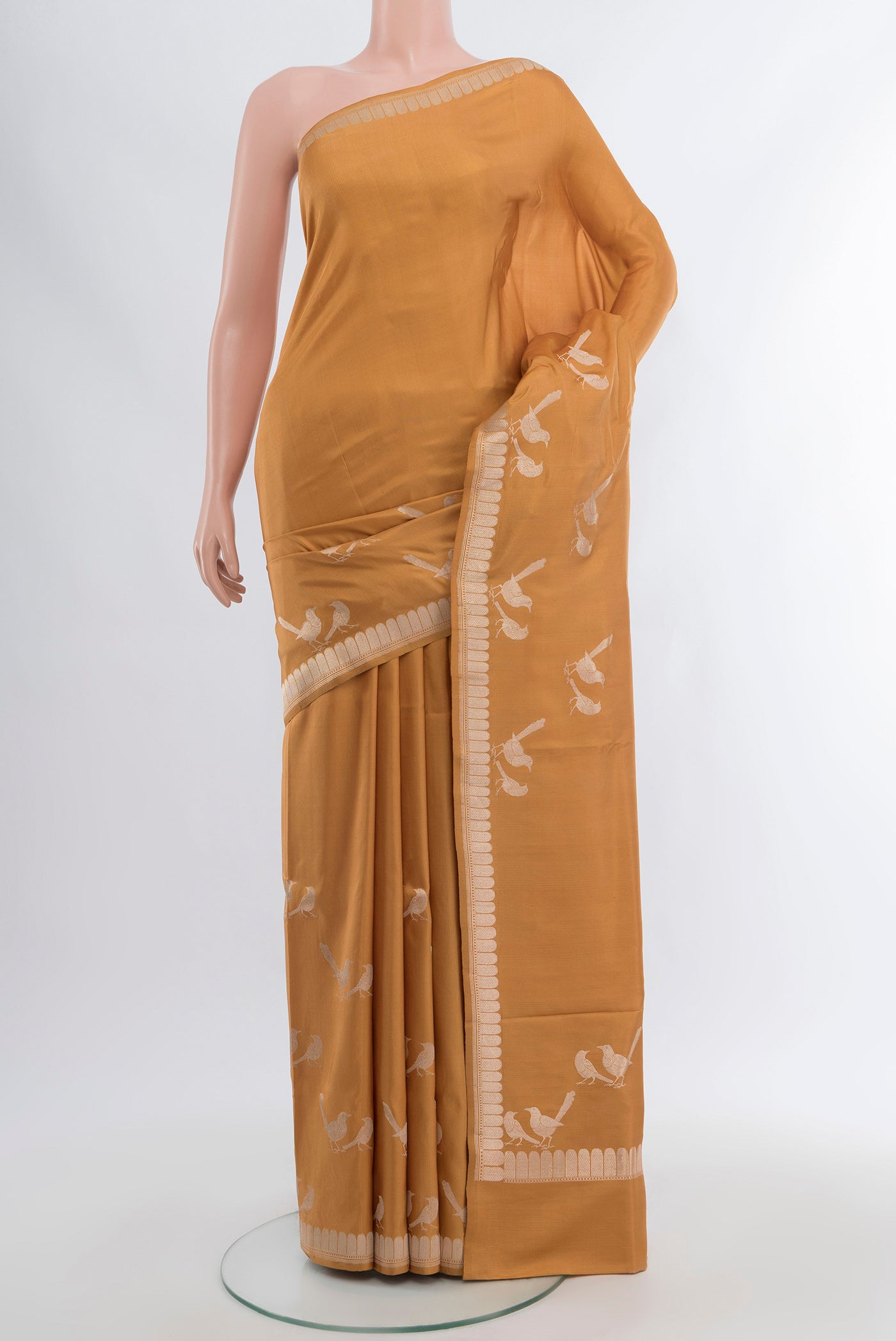 Sandal Banarasi Katan Silk Saree with Zari Butta on the body and Silk Border.  displayed on a mannequin