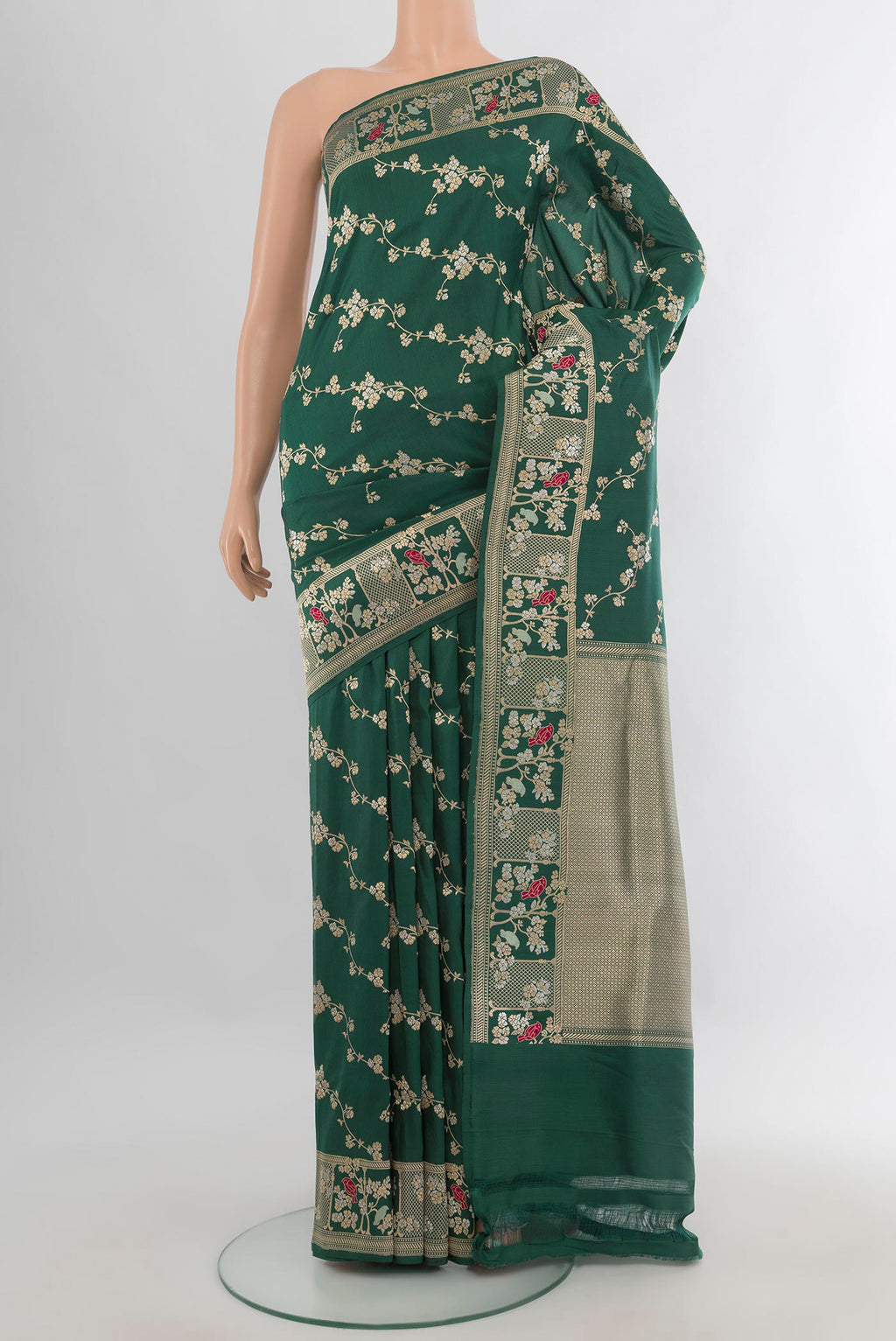 Pure Silk Green Banarasi Saree with Zari Butta on the body and Zari Border.  displayed on a mannequin