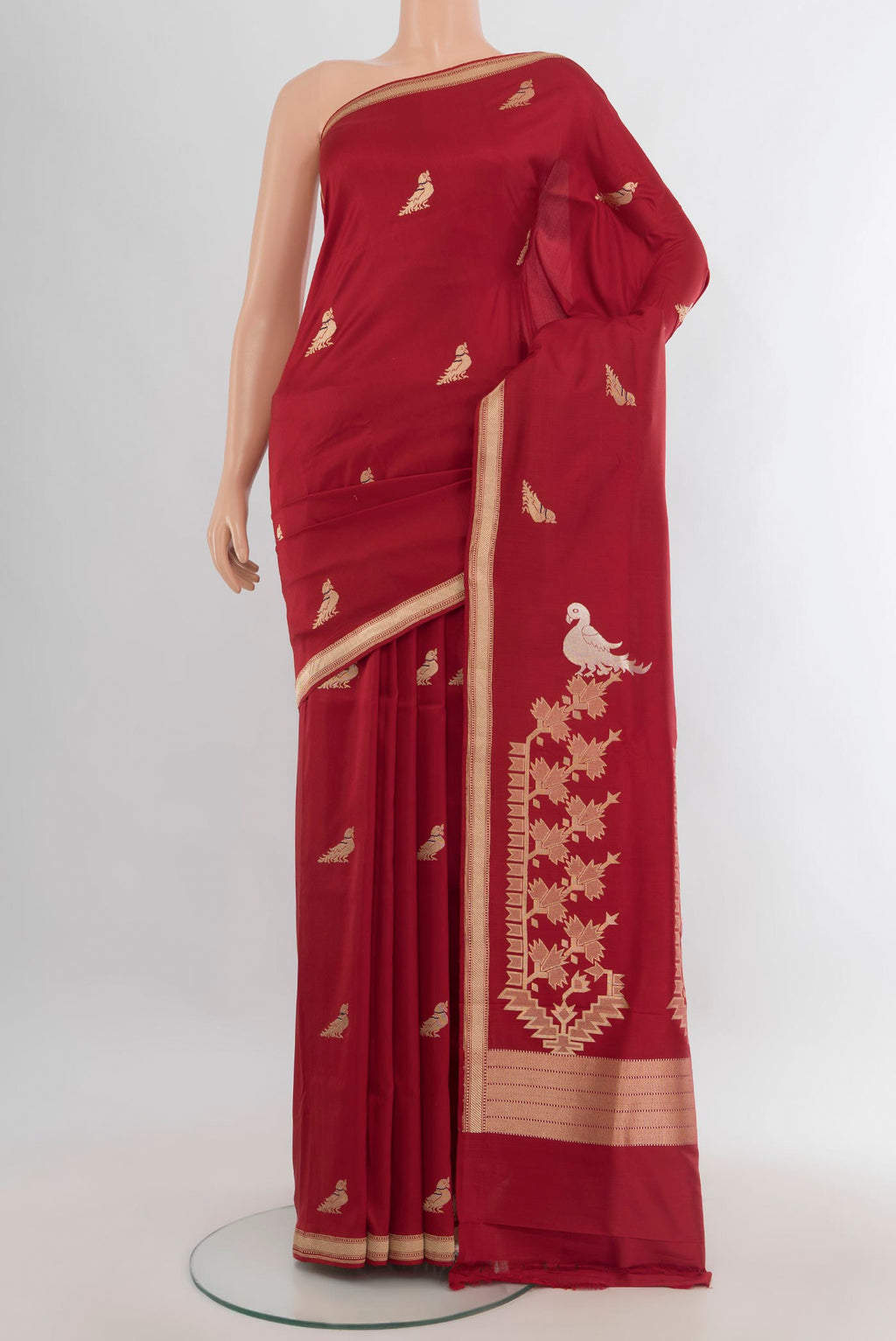 Pure Silk Deep Red Banarasi Saree with Zari Butta on the body and Zari Border.  displayed on a mannequin