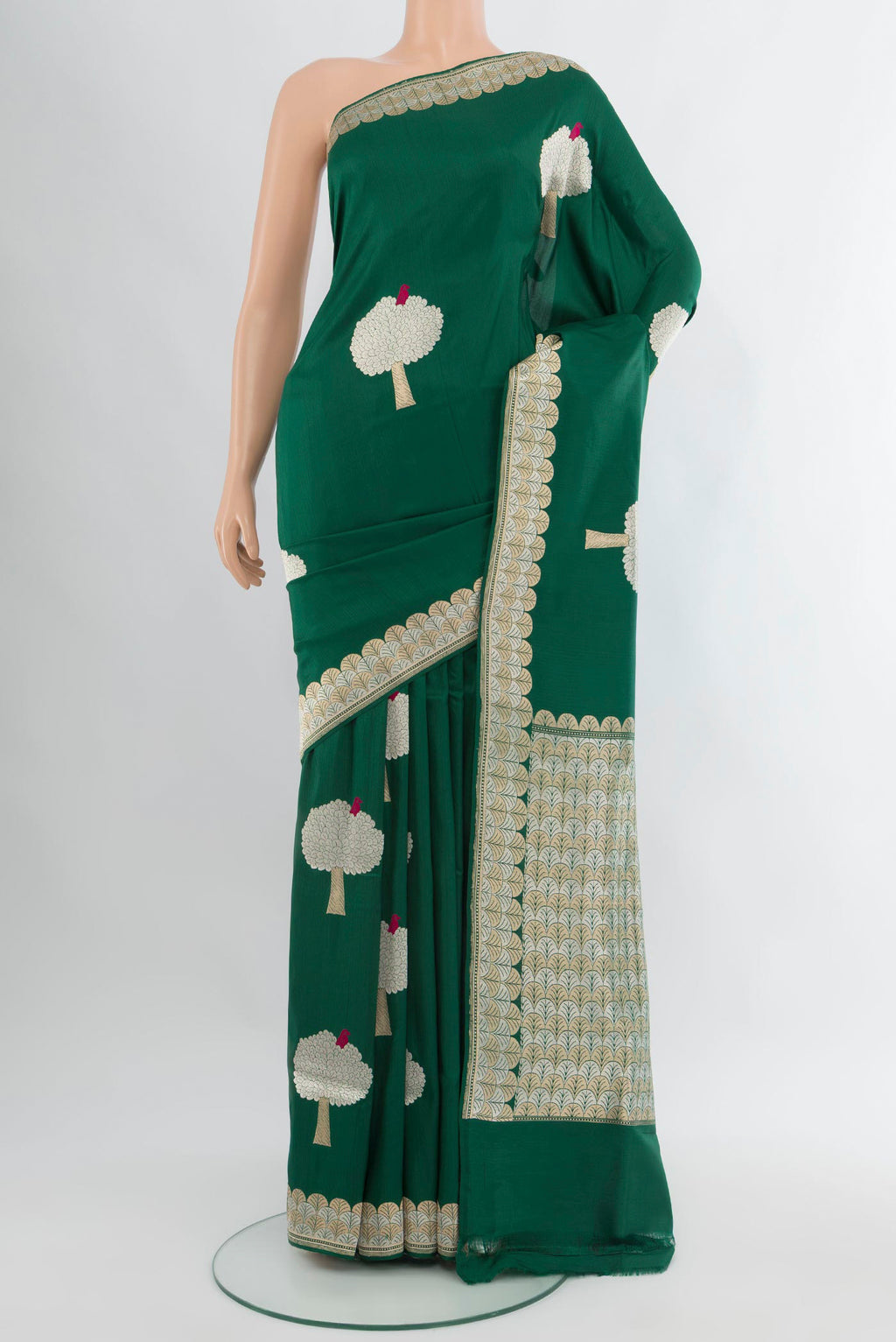 Bottle Green Banarasi Silk Saree with Zari Butta on the body and Zari Border.  displayed on a mannequin
