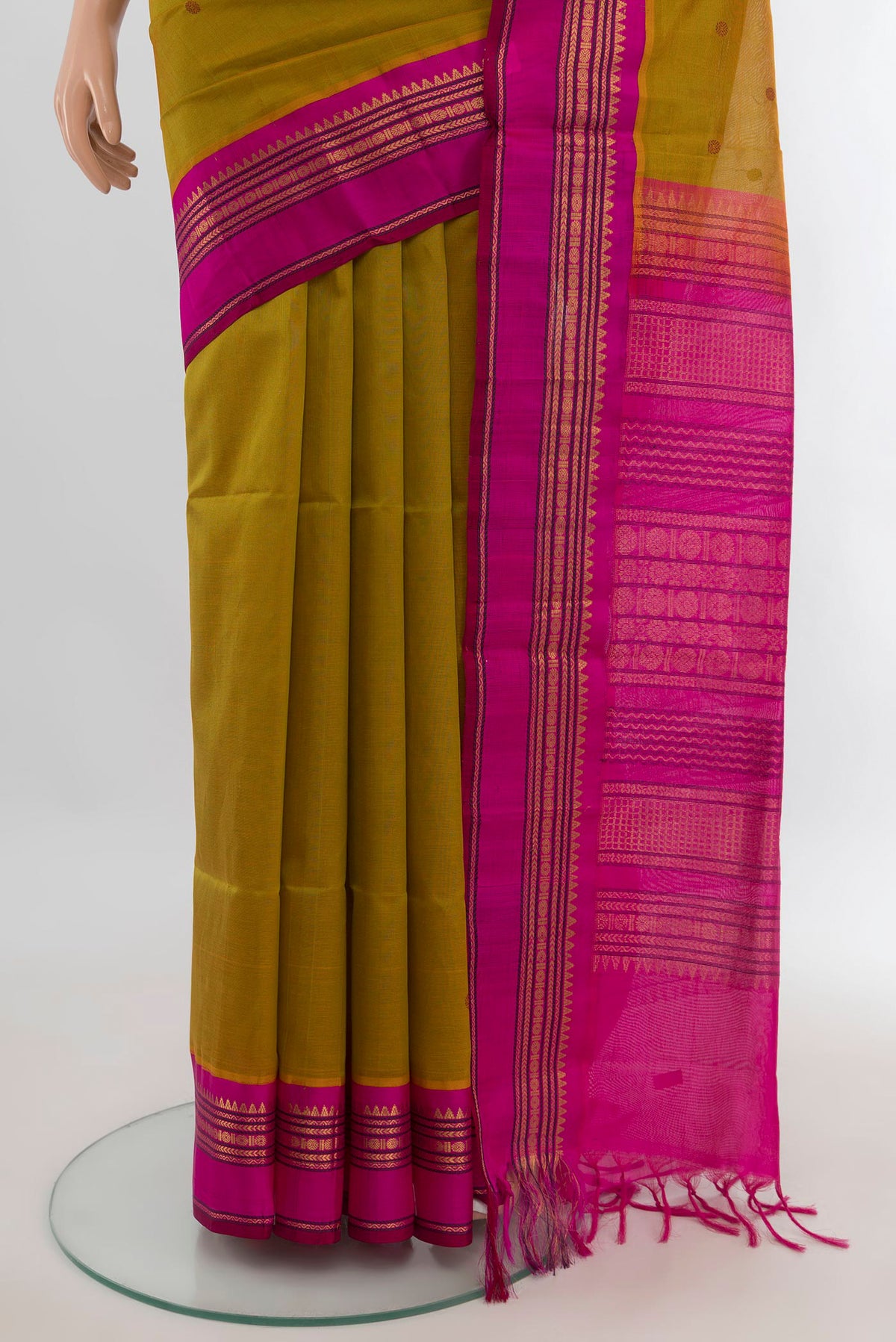 Pleats and pallu of Mehandi Green Silk Cotton Saree with Zari Butta on the body and Zari Border. 