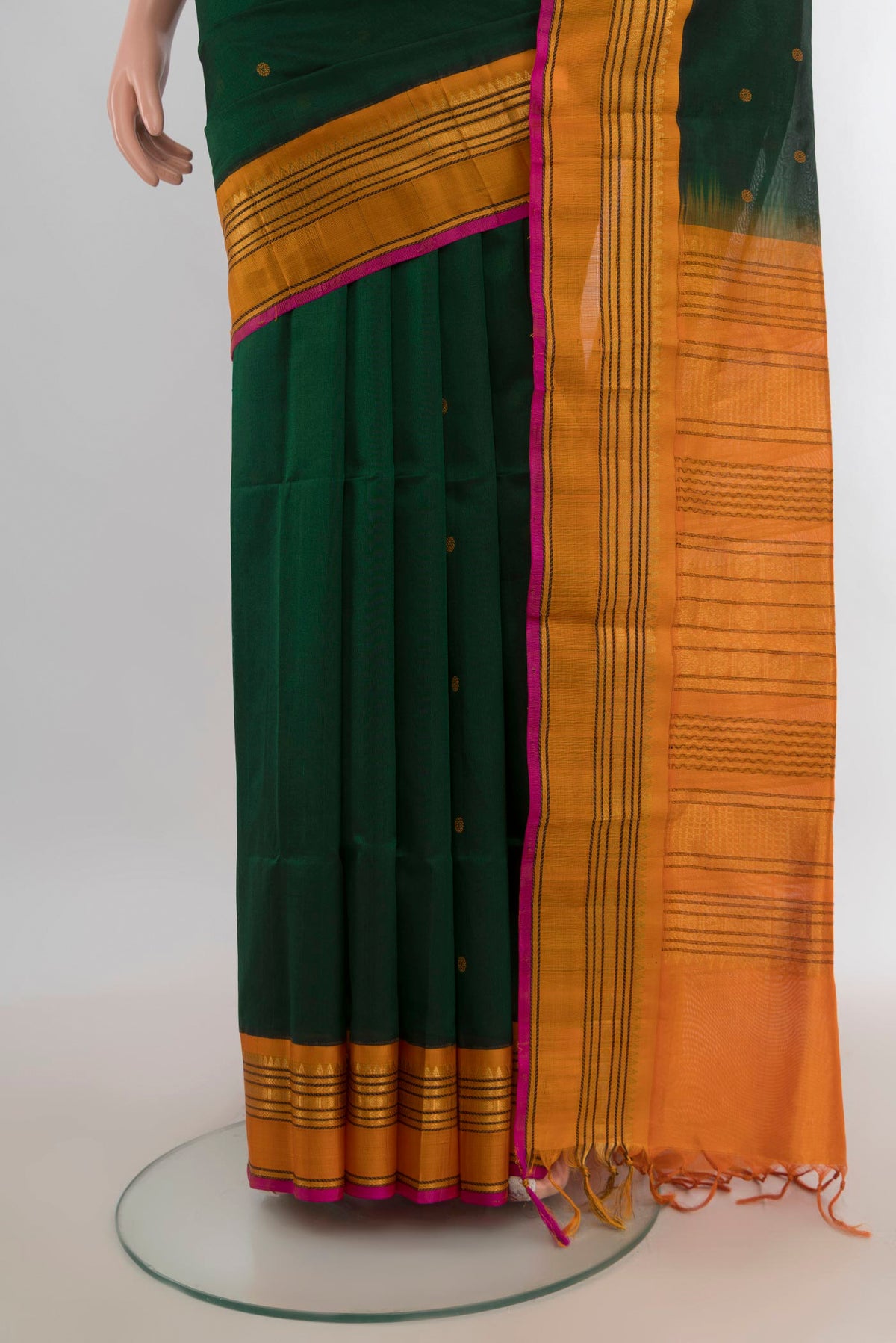 Pleats and pallu of Mint Green Silk Cotton Saree with Zari Butta on the body and Silk Border. 