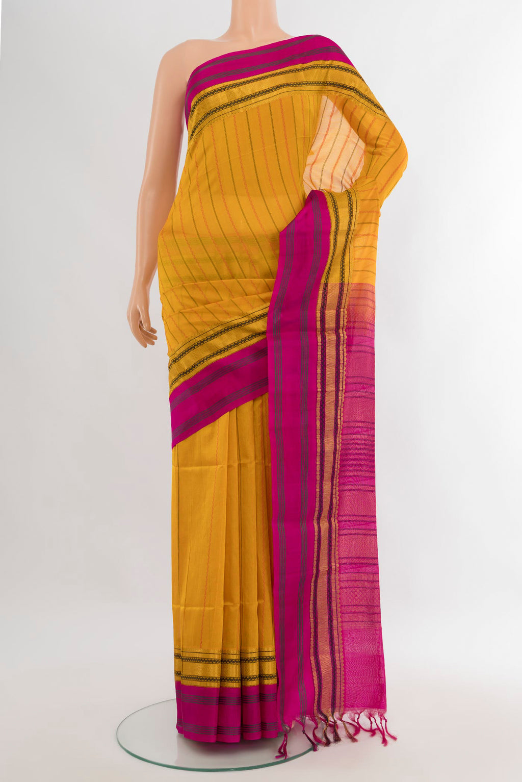 Yellow Silk Cotton Saree with Stripes on the body and Zari Border.  displayed on a mannequin