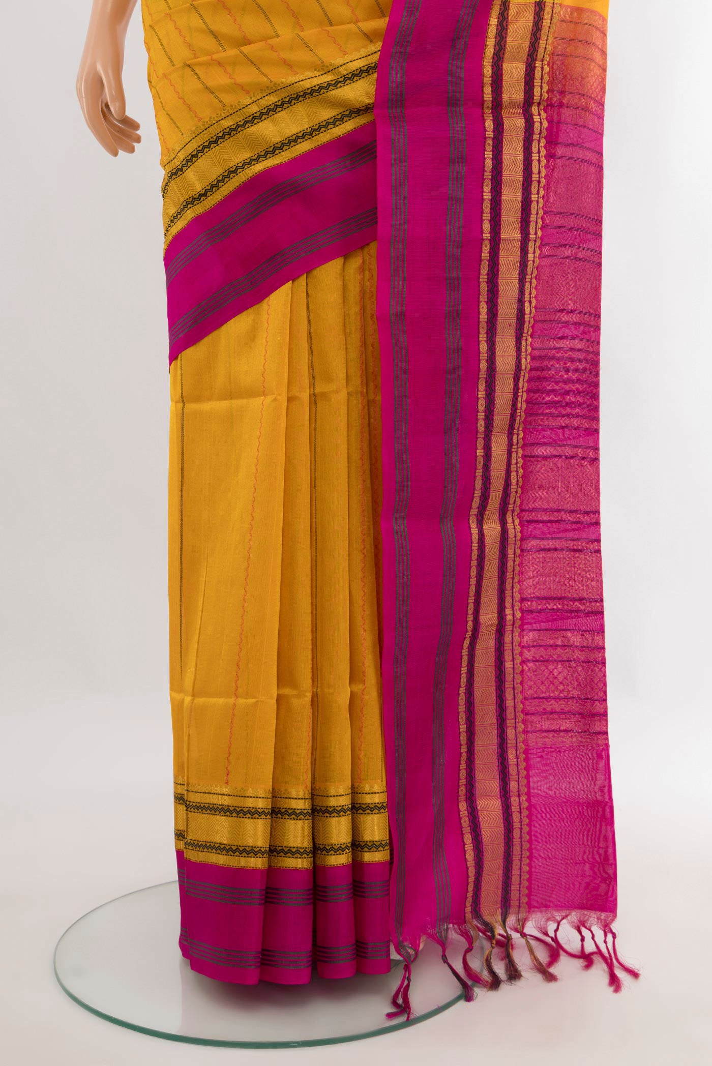 Pleats and pallu of Yellow Silk Cotton Saree with Stripes on the body and Zari Border. 