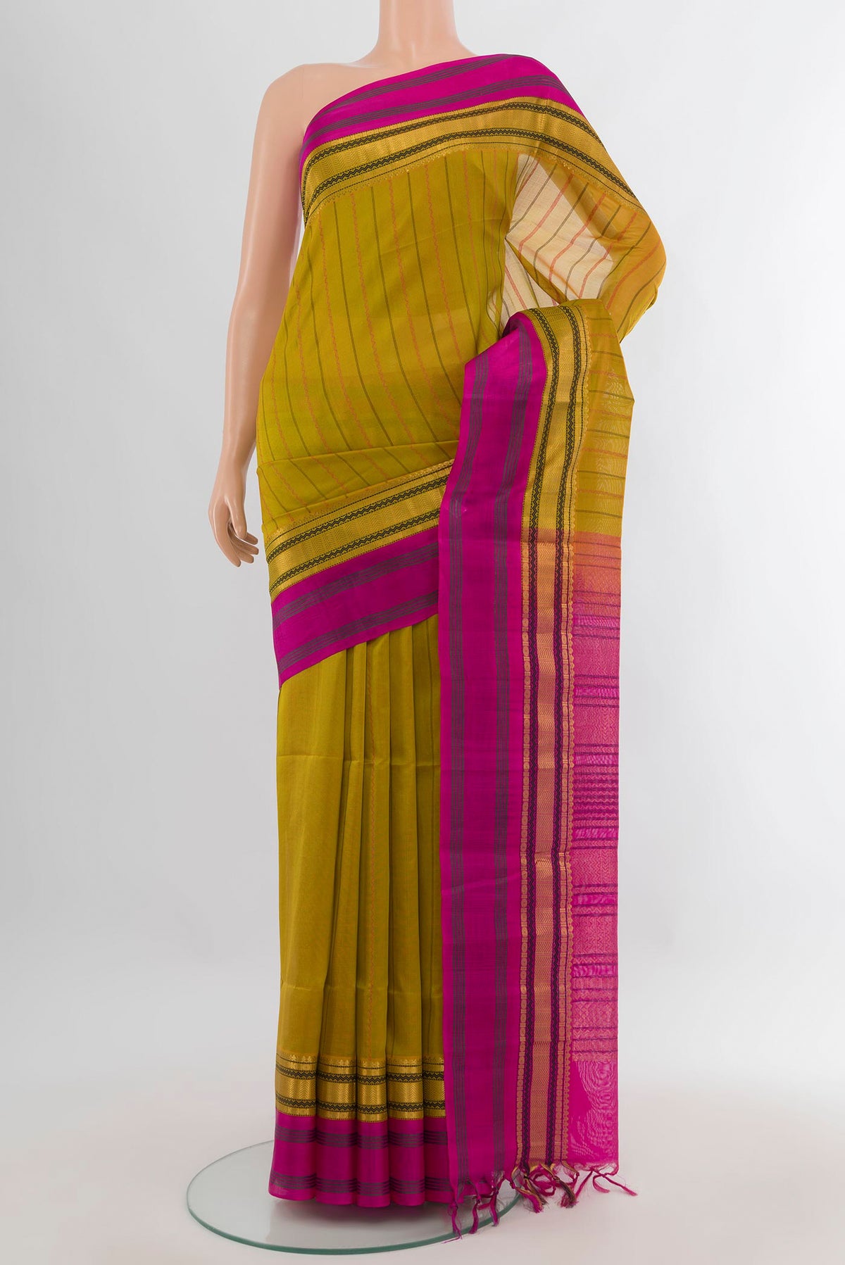 Mehandi Green Silk Cotton Saree with Stripes on the body and Zari Border.  displayed on a mannequin