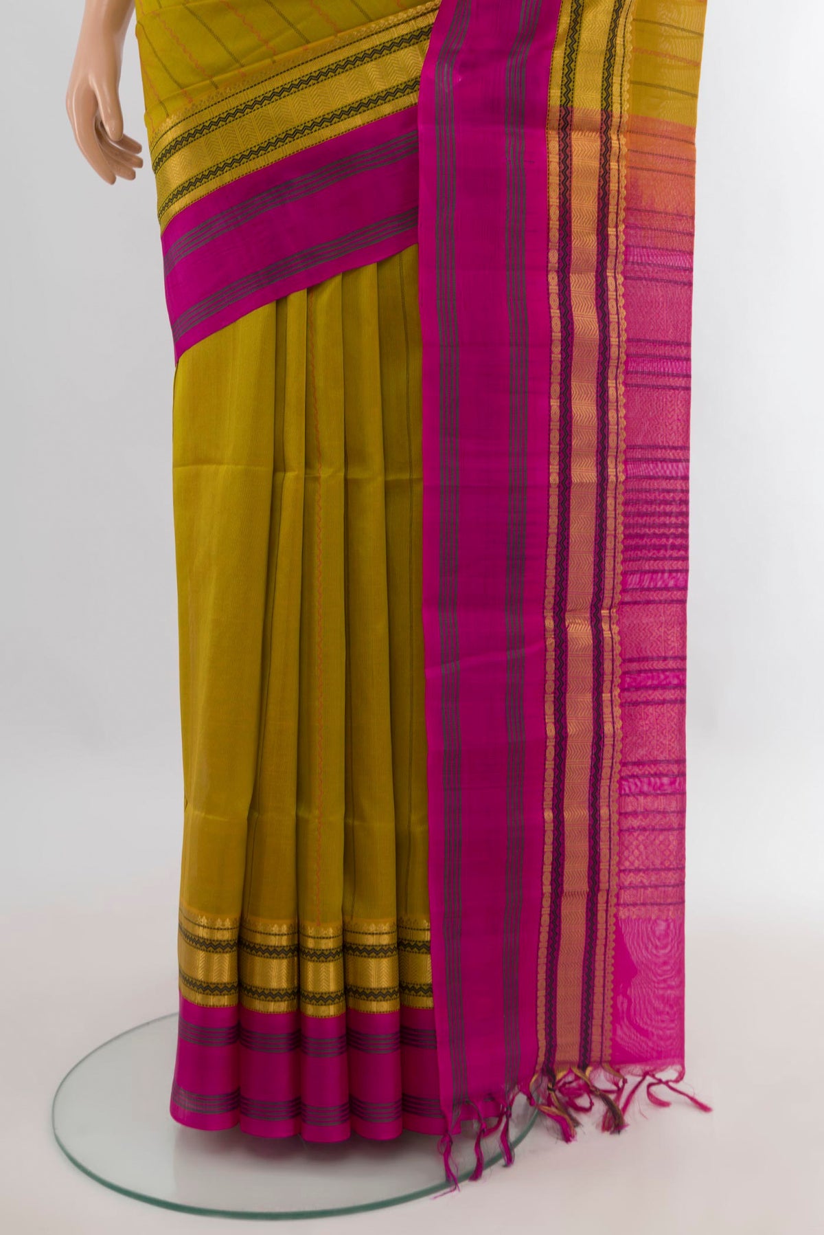 Pleats and pallu of Mehandi Green Silk Cotton Saree with Stripes on the body and Zari Border. 
