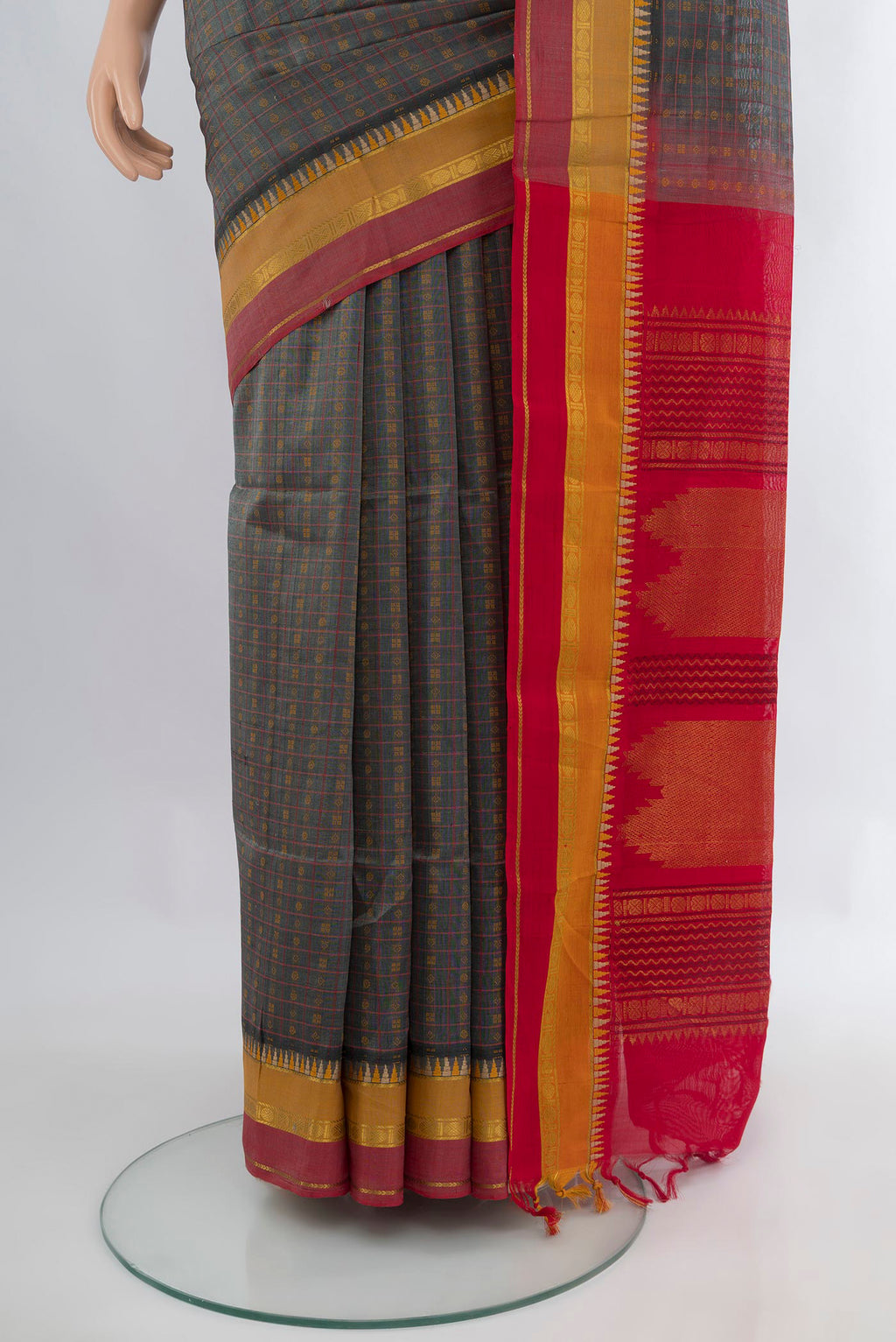 Pleats and pallu of Davys Grey Silk Cotton Saree with Stripes on the body and Zari Border. 