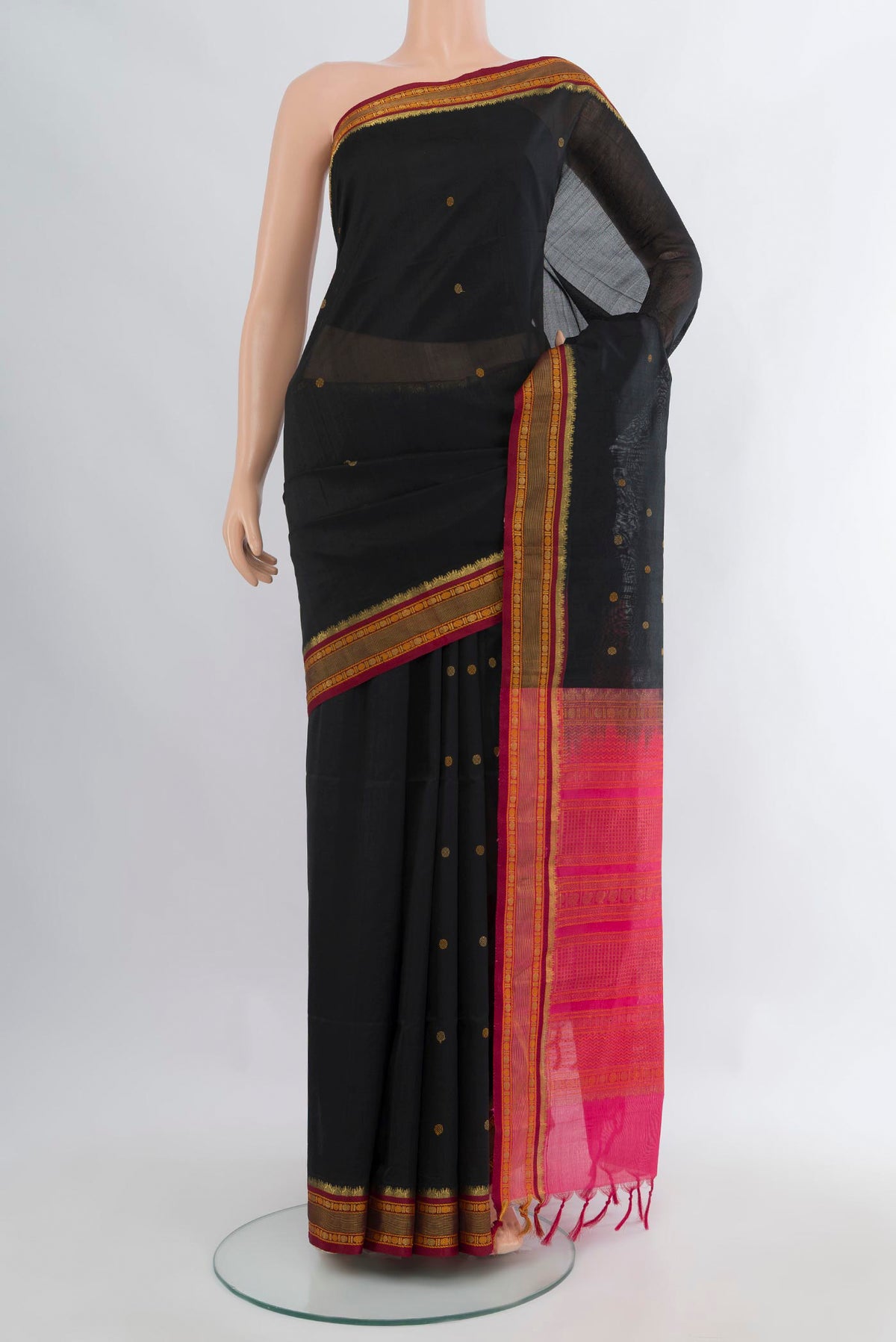 Black Silk Cotton Saree with Zari Butta on the body and Zari Border.  displayed on a mannequin