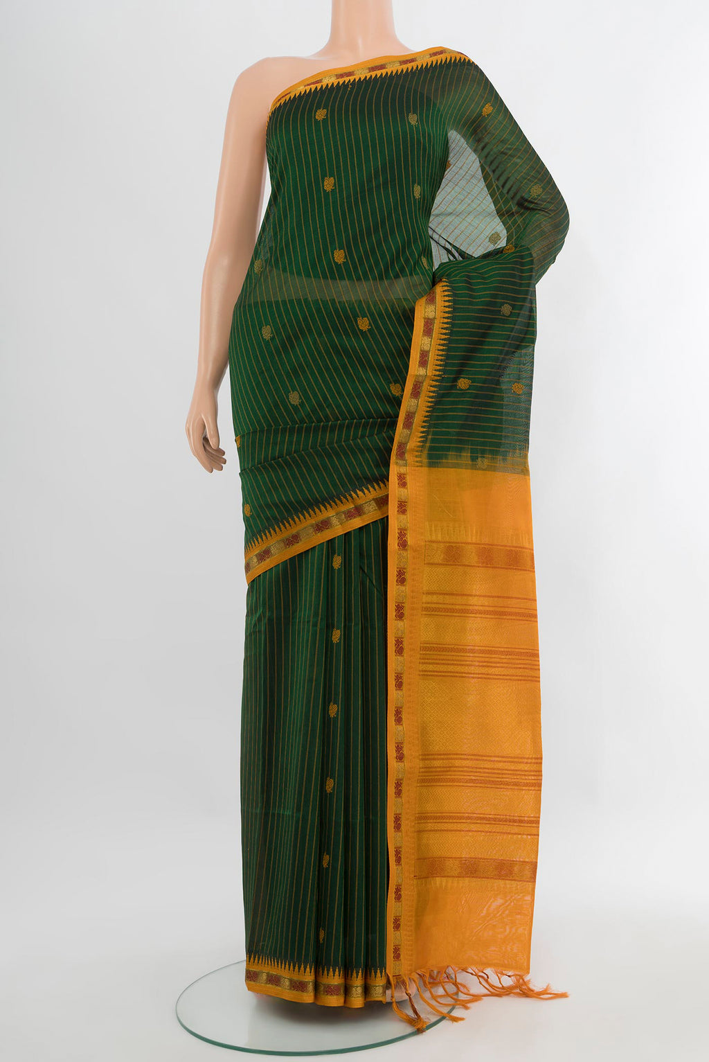 Bottle Green Silk Cotton Saree with Stripes on the body and Zari Border.  displayed on a mannequin
