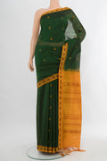 Bottle Green Silk Cotton Saree with Stripes on the body and Zari Border.  displayed on a mannequin