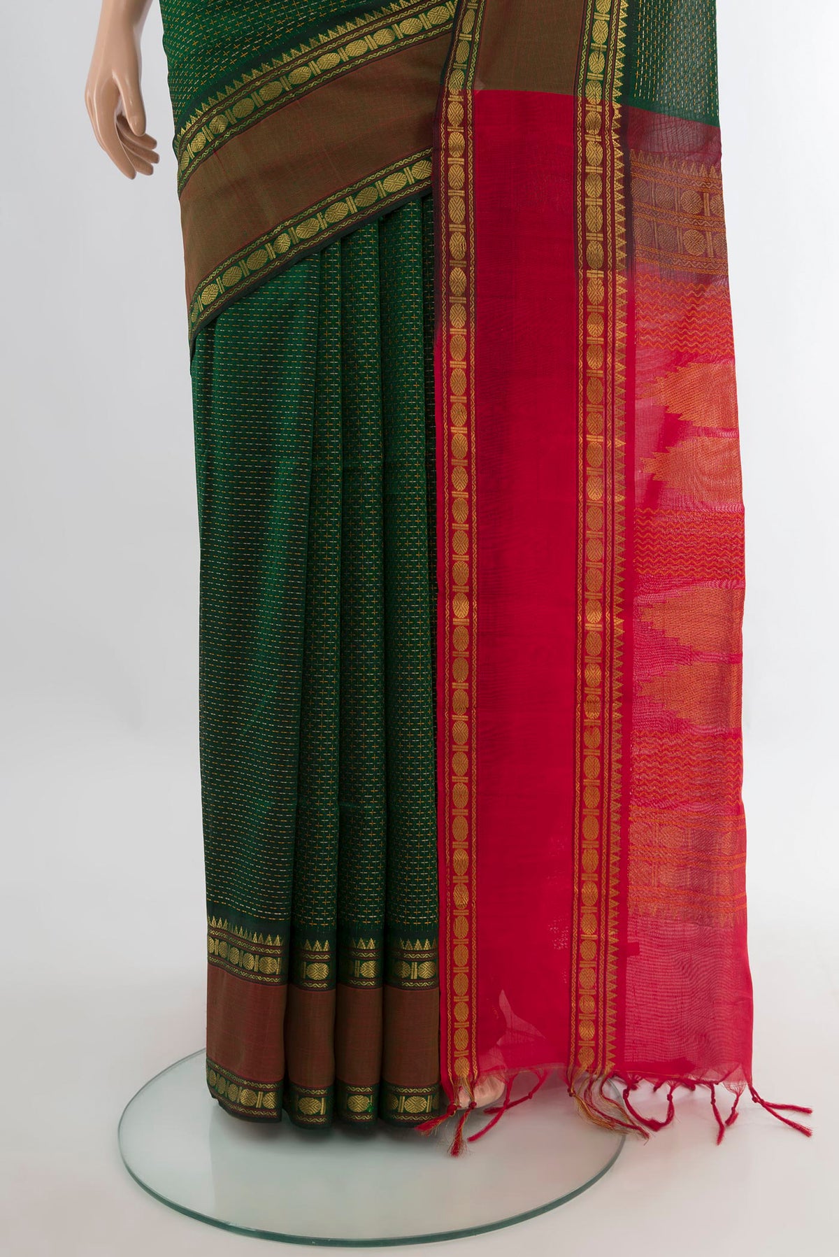 Pleats and pallu of Bottle Green Silk Cotton Saree with Checked design on the body and Zari Border. 