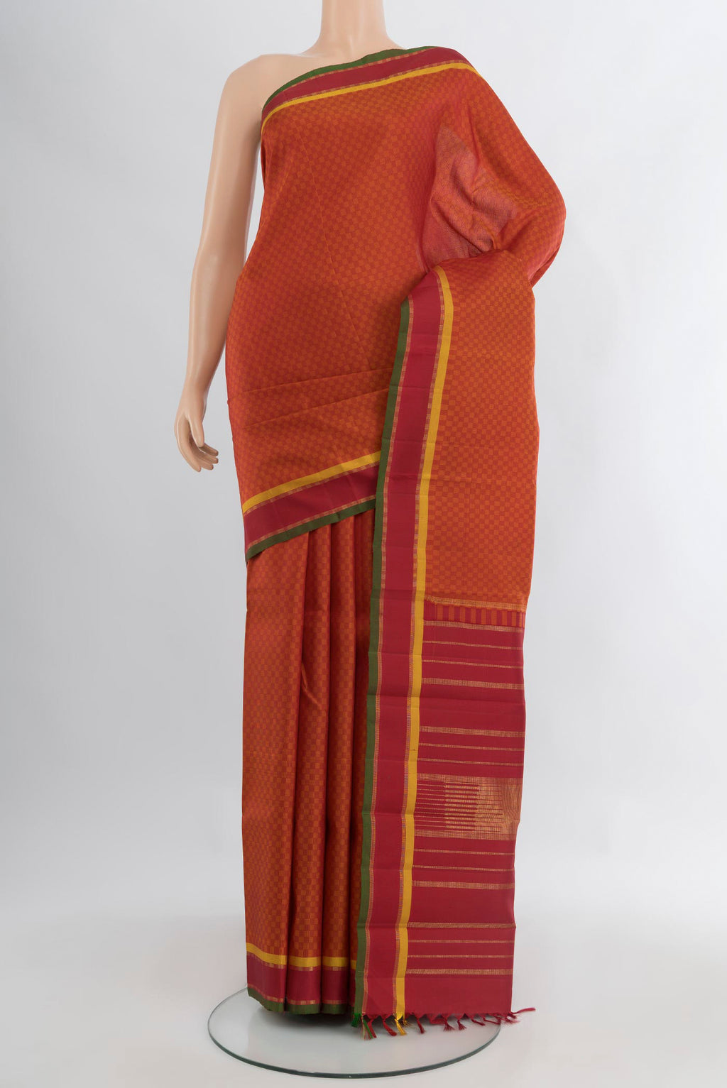 Brick Orange Kanjivaram Silk Saree with Checked design on the body and Zari Border.  displayed on a mannequin