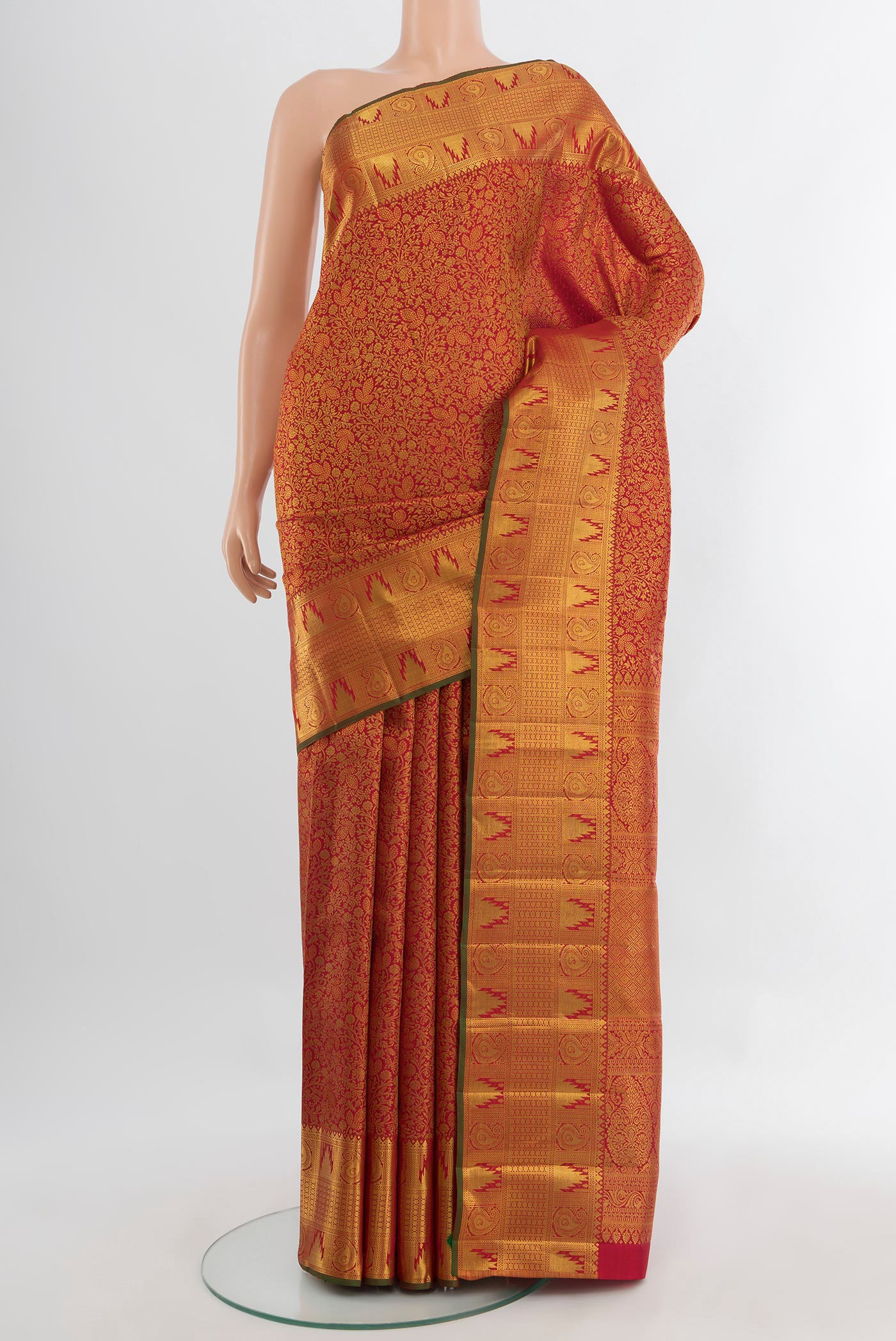 Pure Silk Pure Zari Maroon Kanjivaram Saree with Zari Butta on the body and Silk Border.  displayed on a mannequin