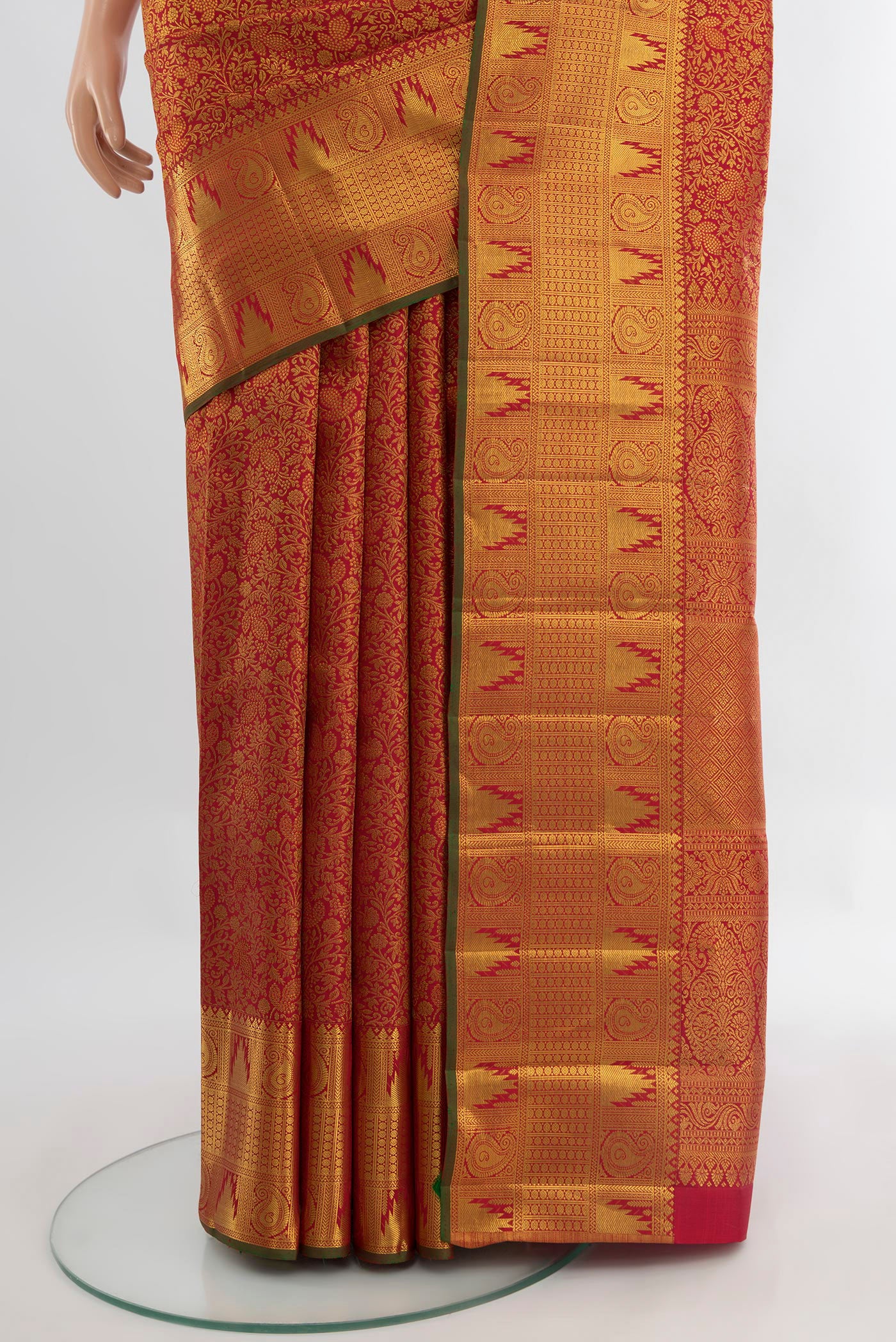 Pleats and pallu of Pure Silk Pure Zari Maroon Kanjivaram Saree with Zari Butta on the body and Silk Border. 