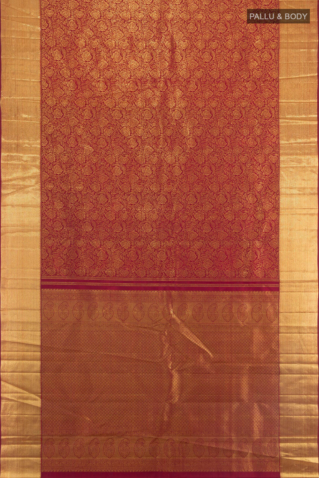 Flat view of Maroon Kanchipuram Silk Saree with Zari Brocade on the body and Zari Border. 