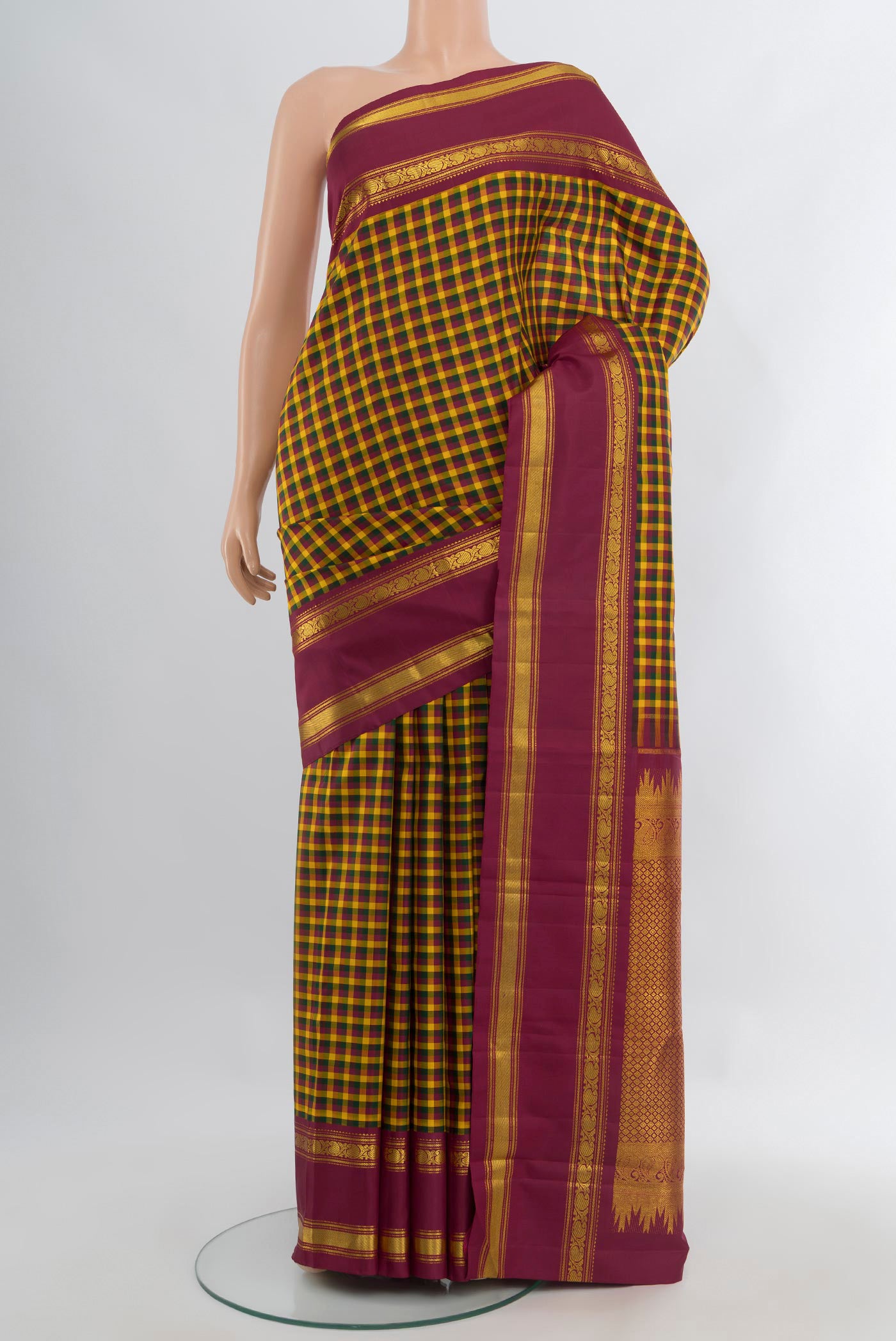 Pure Silk Pure Zari Multi Color Kanchipuram Saree with Checked design on the body and Plain Border.  displayed on a mannequin