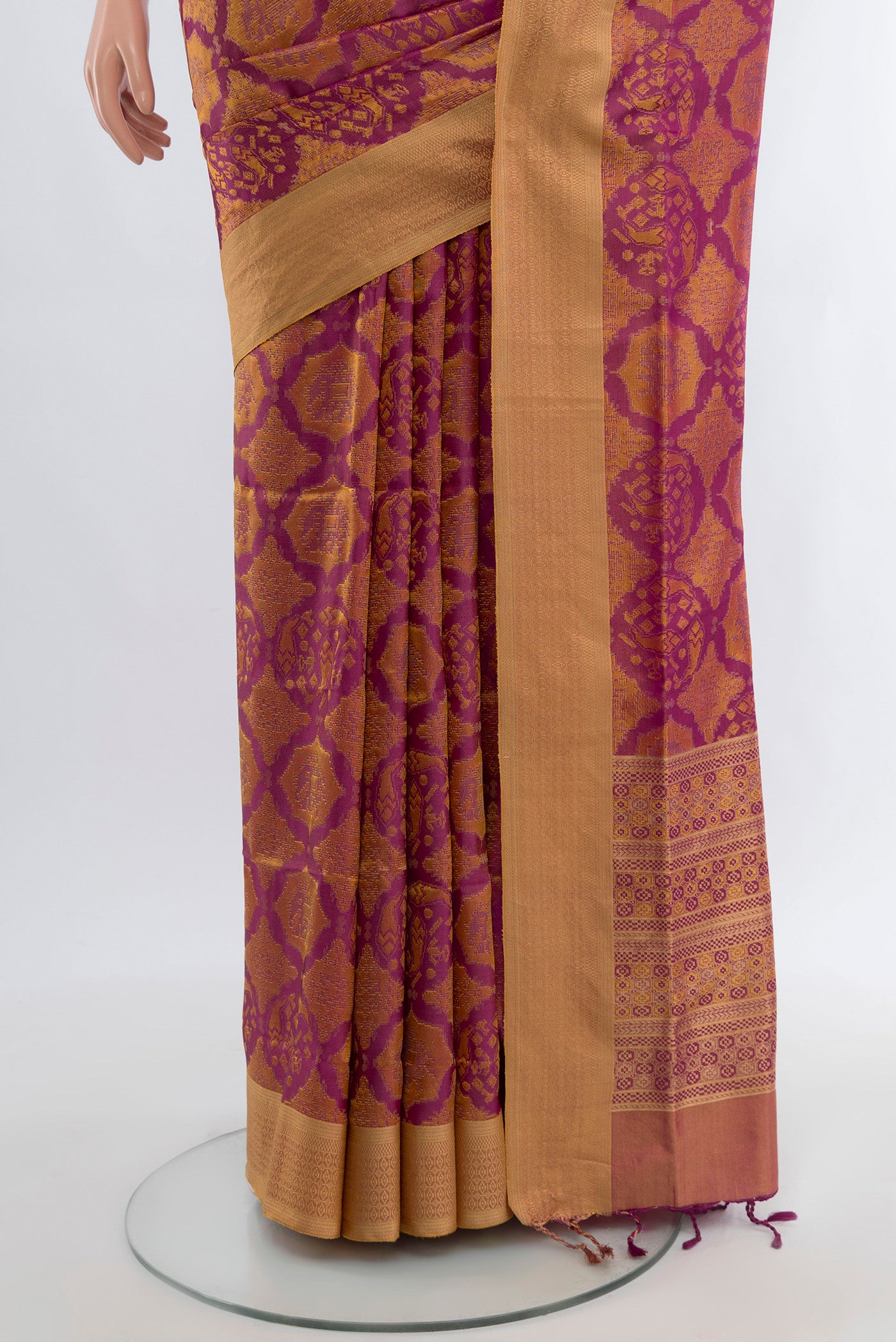 Pleats and pallu of Purple Soft Silk Saree with Zari Butta on the body and Silk Border. 