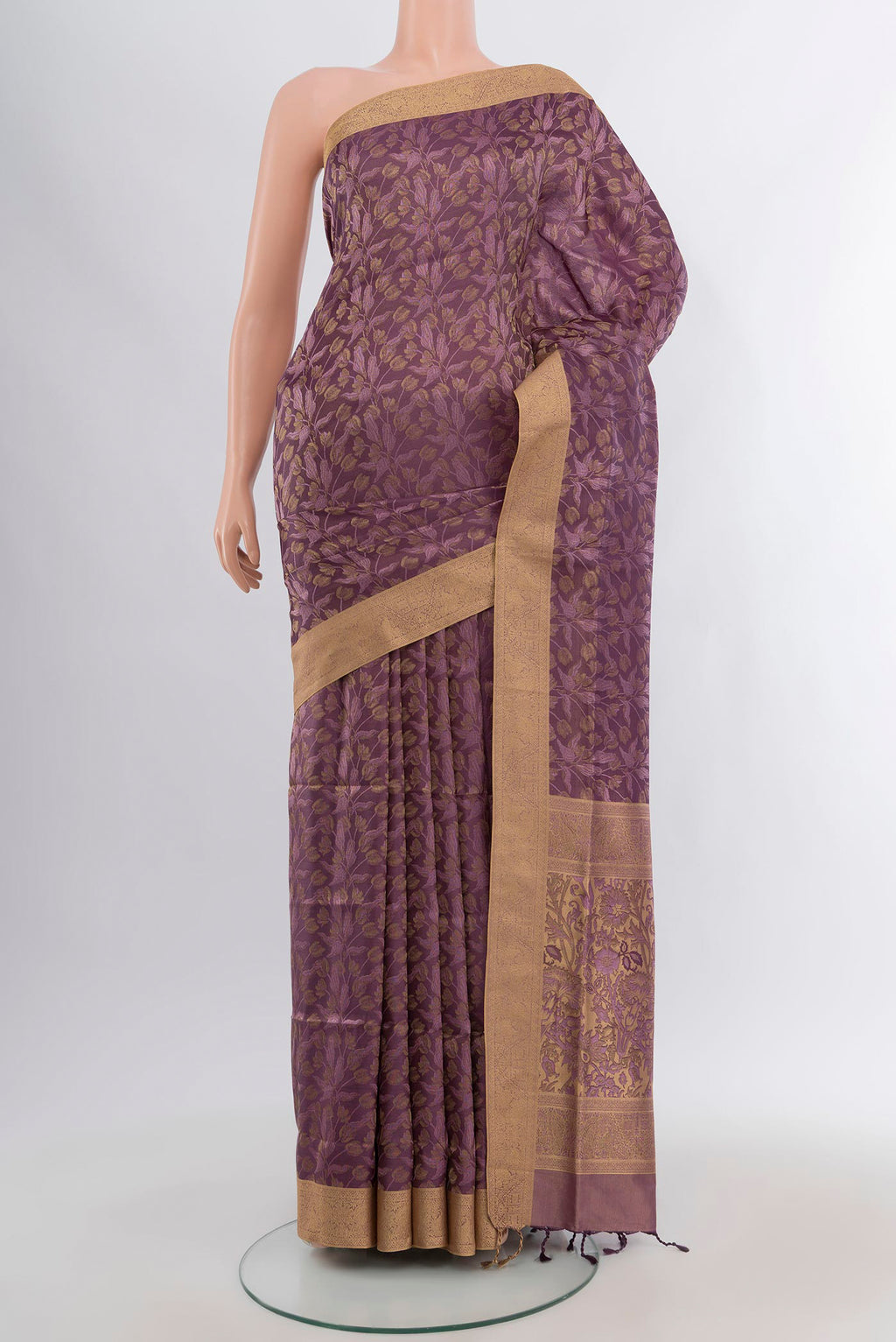 Mauve Soft Silk Saree with Zari Butta on the body and Zari Border.  displayed on a mannequin