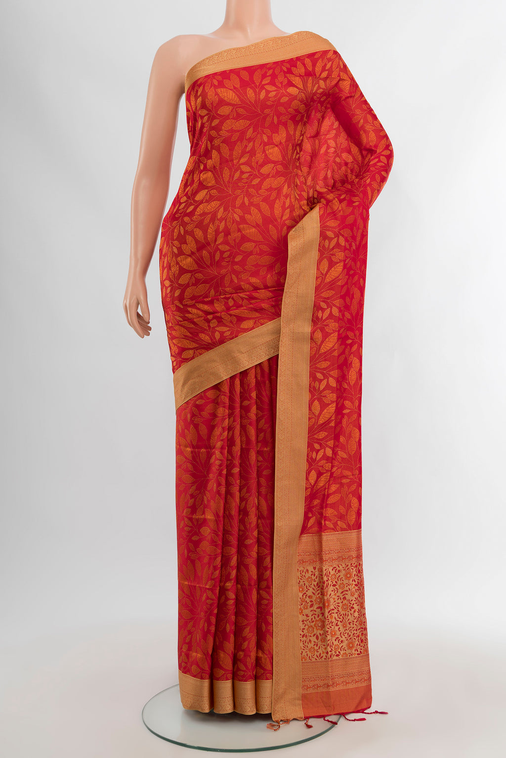 Brick Orange Soft Silk Saree with Jacquard design on the body and Thread Border.  displayed on a mannequin