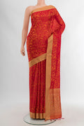 Brick Orange Soft Silk Saree with Jacquard design on the body and Thread Border.  displayed on a mannequin