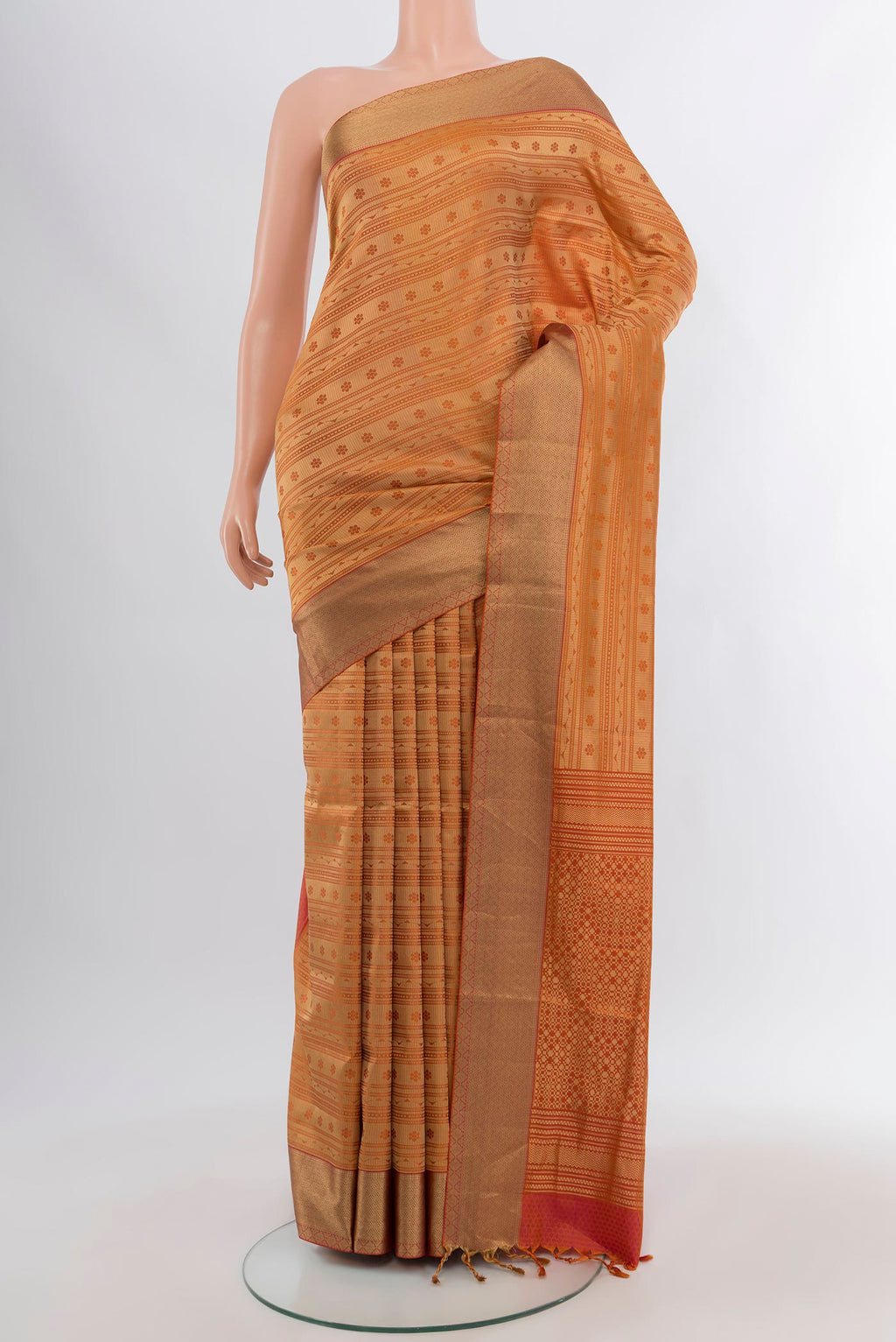 Rust Soft Silk Saree with Jacquard design on the body and Thread Border.  displayed on a mannequin