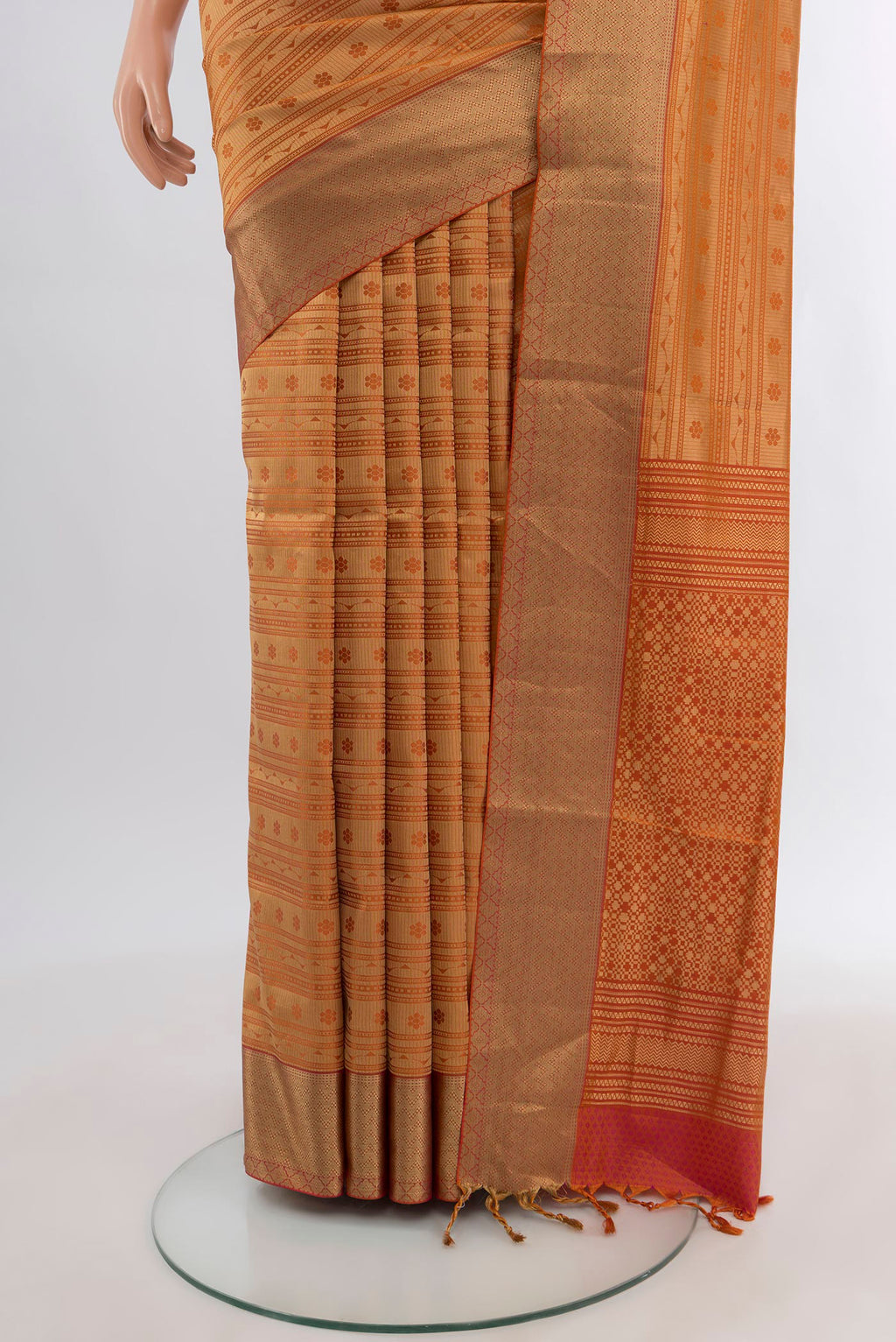 Pleats and pallu of Rust Soft Silk Saree with Jacquard design on the body and Thread Border. 