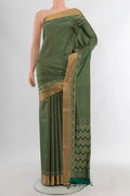 Green Soft Silk Saree with Jacquard design on the body and Zari Border.  displayed on a mannequin