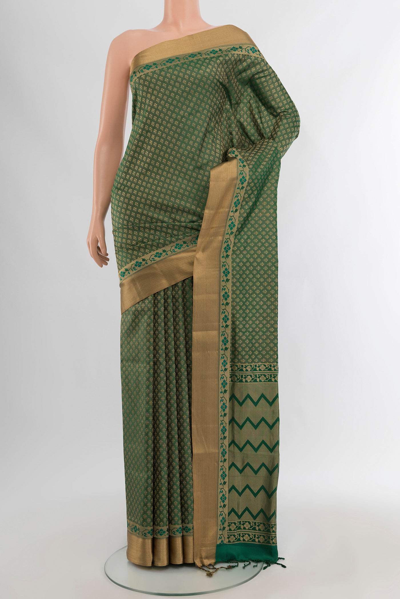 Green Soft Silk Saree with Jacquard design on the body and Zari Border.  displayed on a mannequin