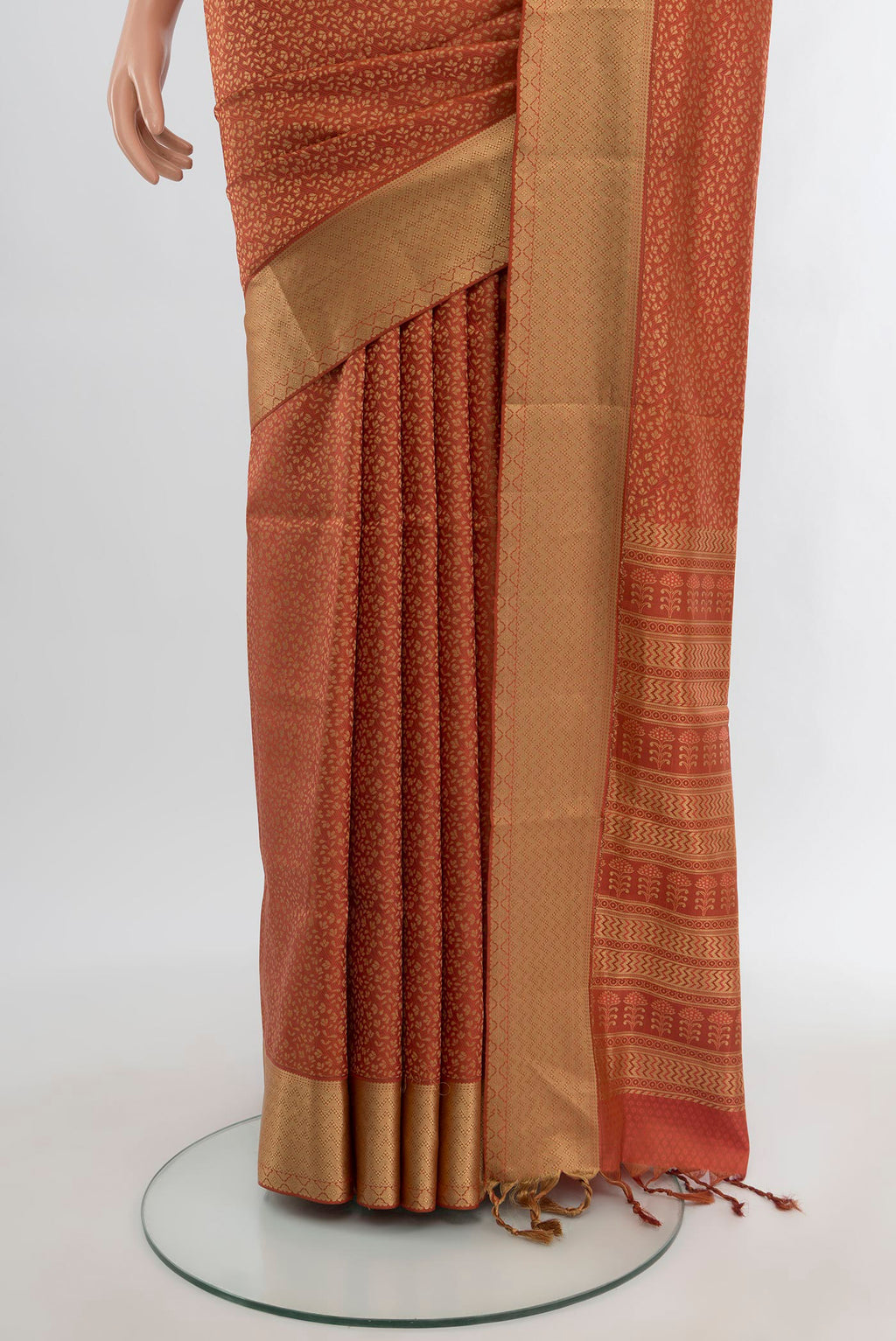 Pleats and pallu of Rust Soft Silk Saree with Jacquard design on the body and Thread Border. 