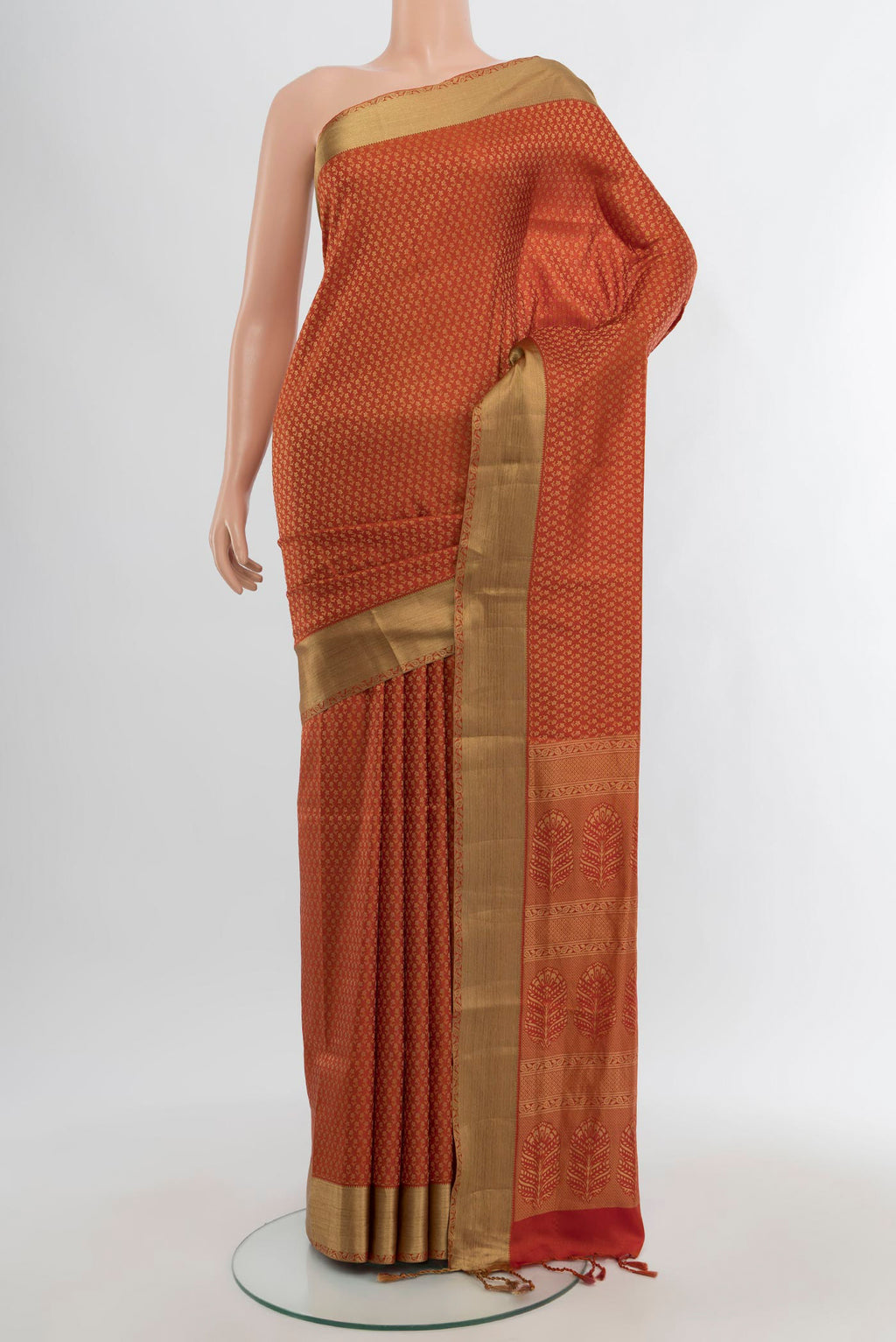 Rust Soft Silk Saree with Jacquard design on the body and Thread Border.  displayed on a mannequin
